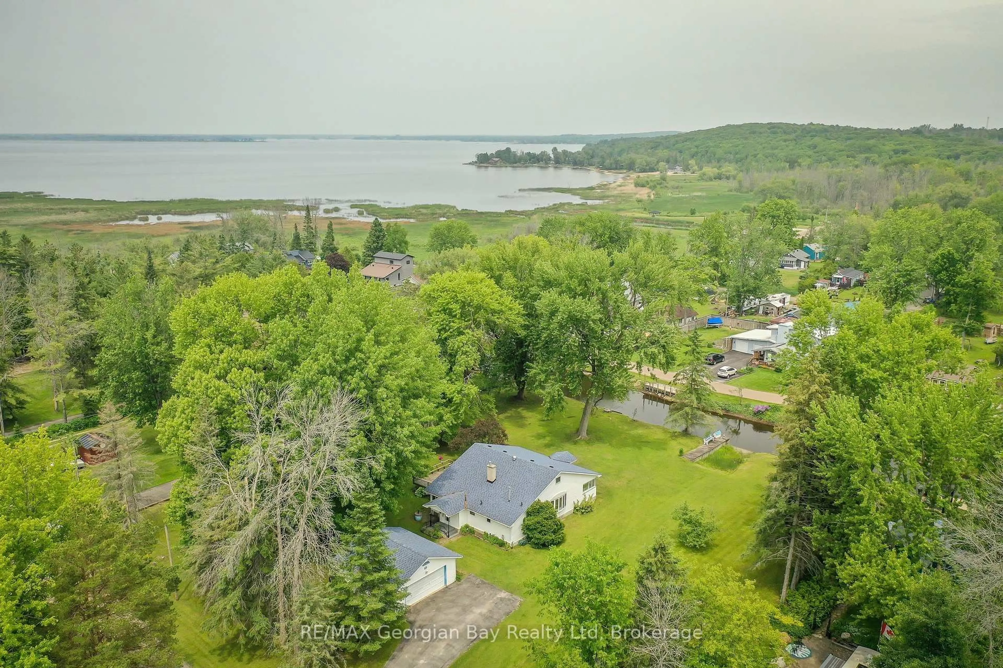 A pic from outside/outdoor area/front of a property/back of a property/a pic from drone, water/lake/river/ocean view for 31 Hearthstone Dr, Tay Ontario L0K 2C0