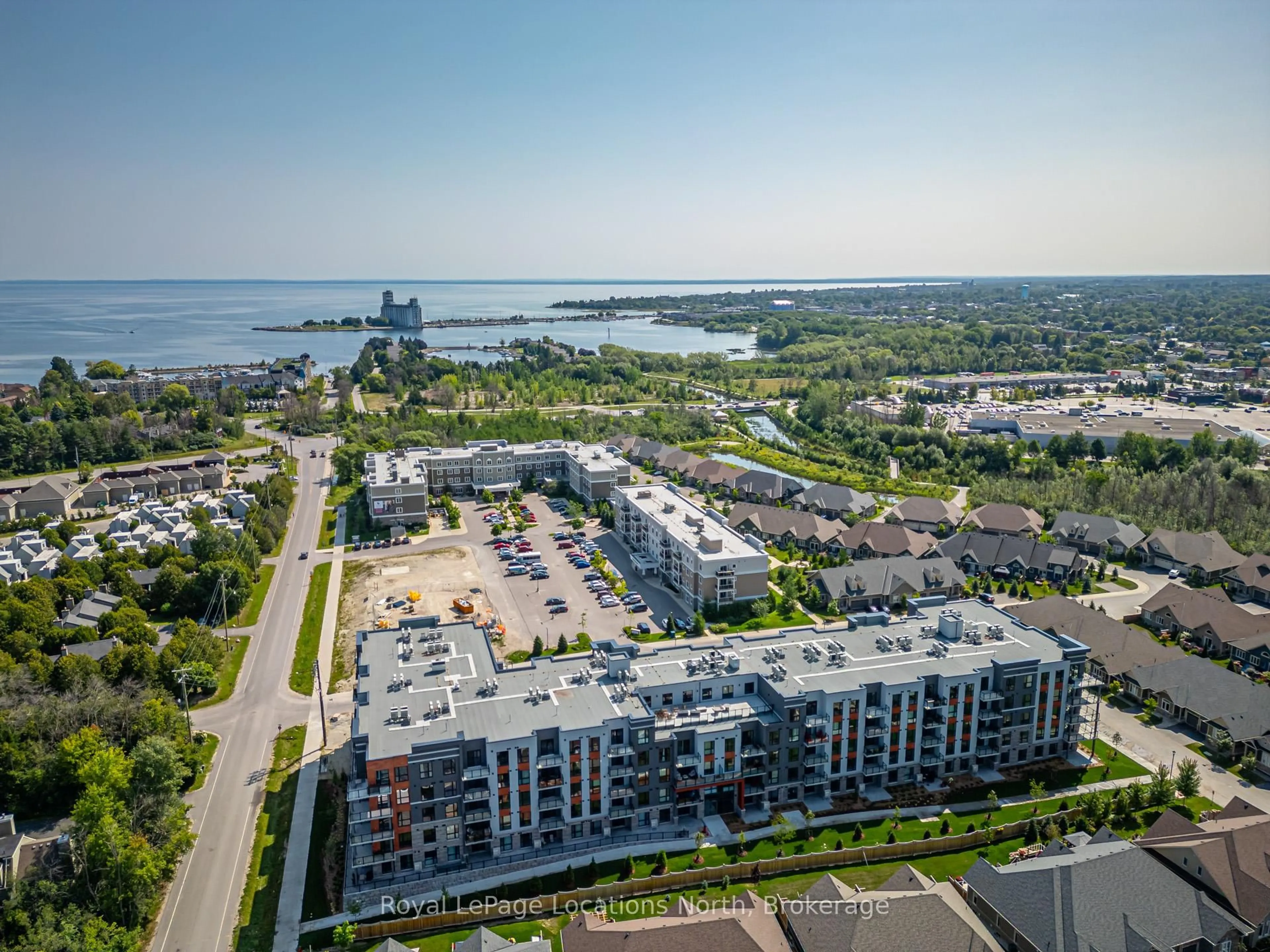 A pic from outside/outdoor area/front of a property/back of a property/a pic from drone, water/lake/river/ocean view for 4 Kimberly Lane #309, Collingwood Ontario L9Y 5B4