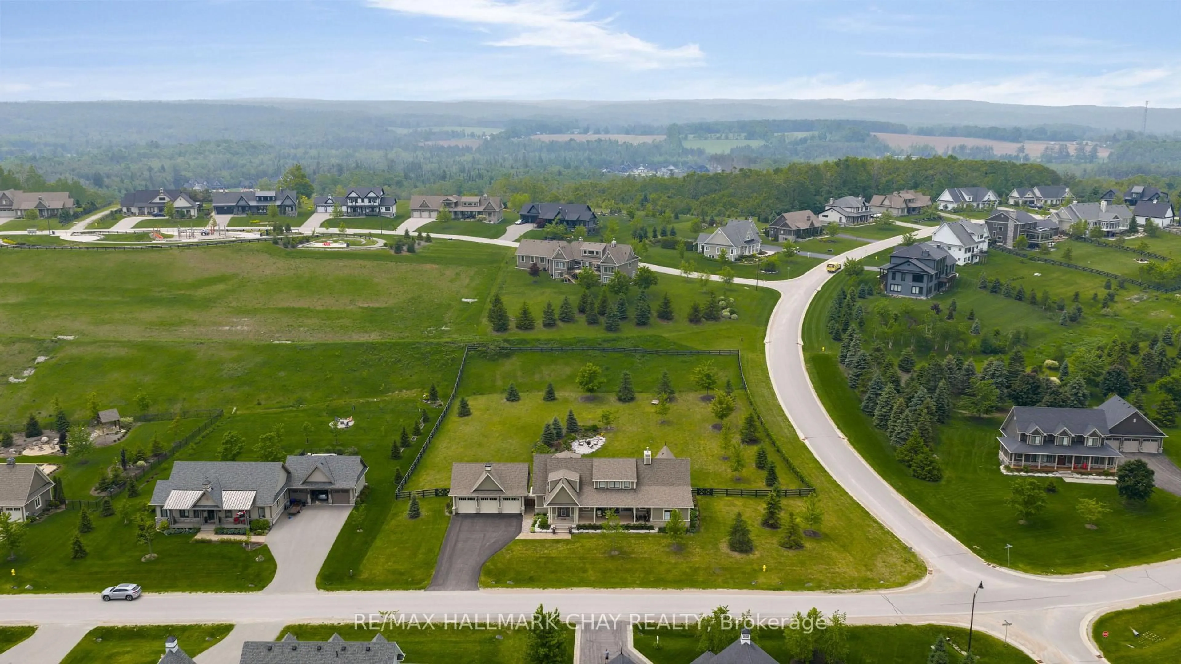 A pic from outside/outdoor area/front of a property/back of a property/a pic from drone, mountain view for 12 Thoroughbred Dr, Oro-Medonte Ontario L0K 1E0