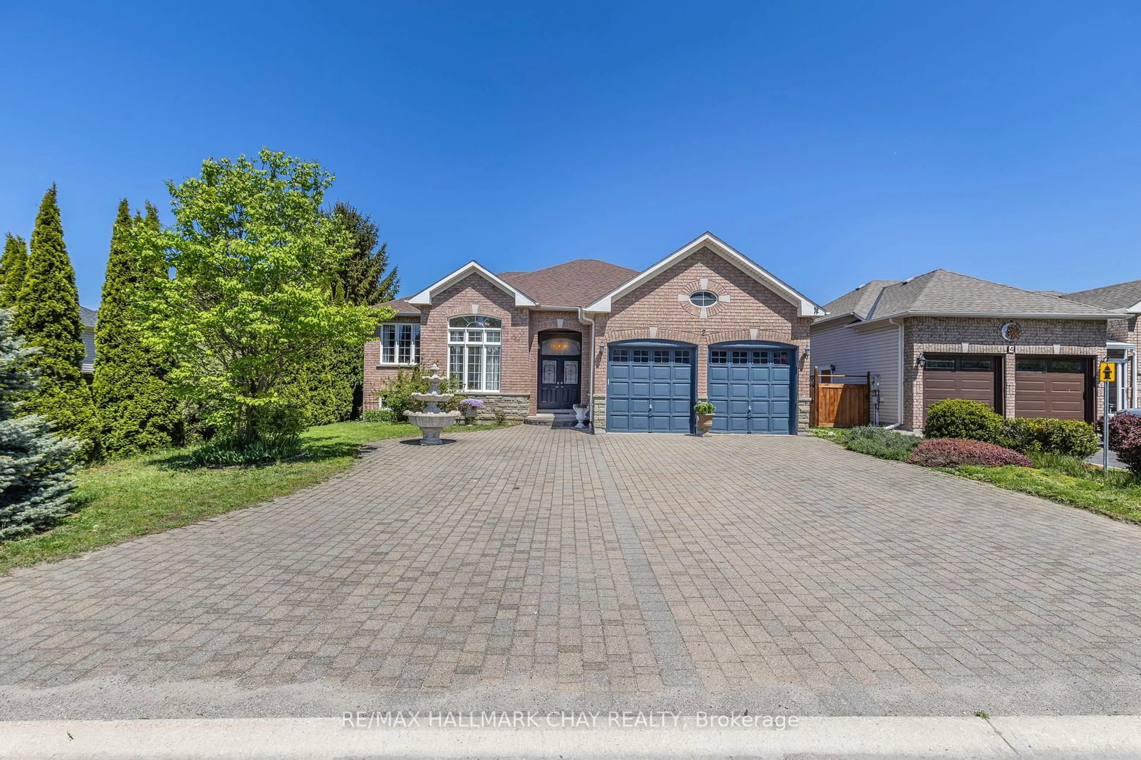 Home with brick exterior material, street for 2 Old Hickory Lane, Wasaga Beach Ontario L9Z 3A9