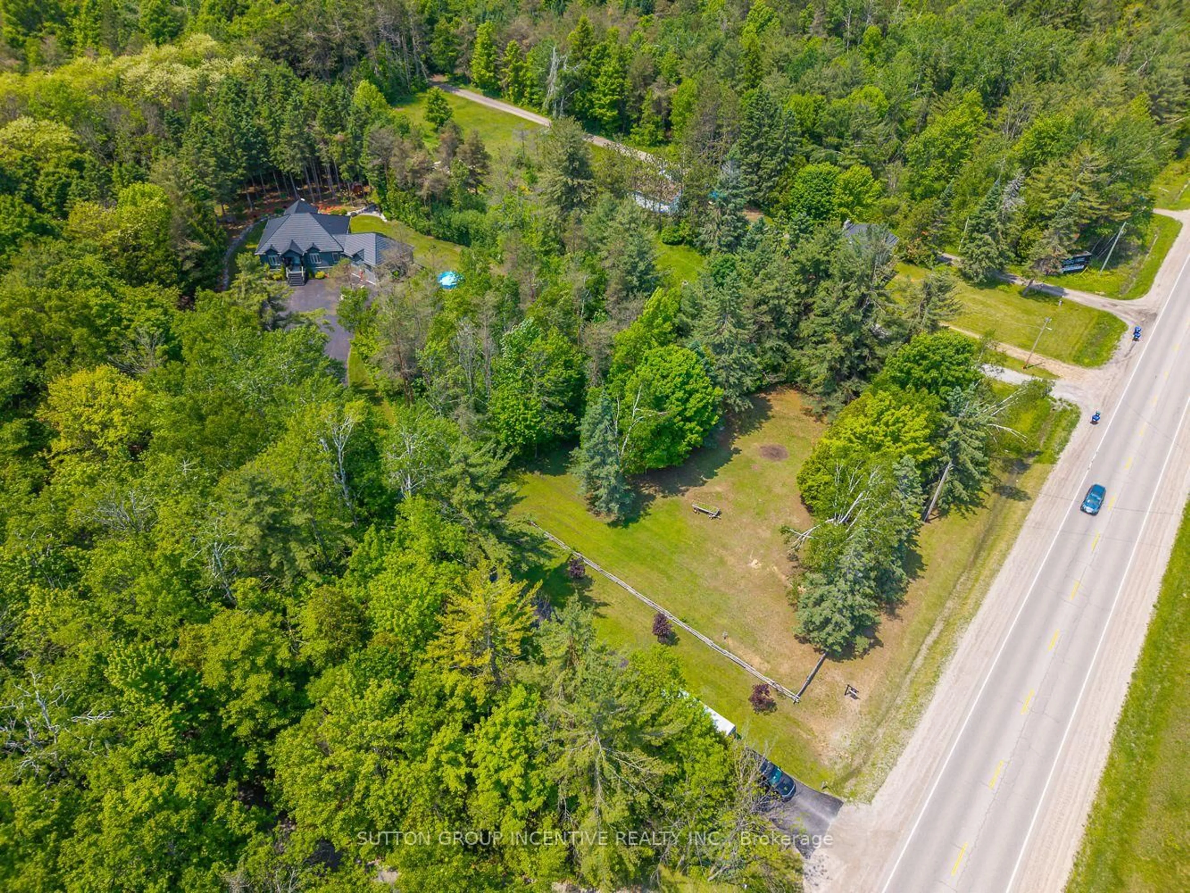 A pic from outside/outdoor area/front of a property/back of a property/a pic from drone, forest/trees view for 7070 93 Highway, Tiny Ontario L0K 2E0