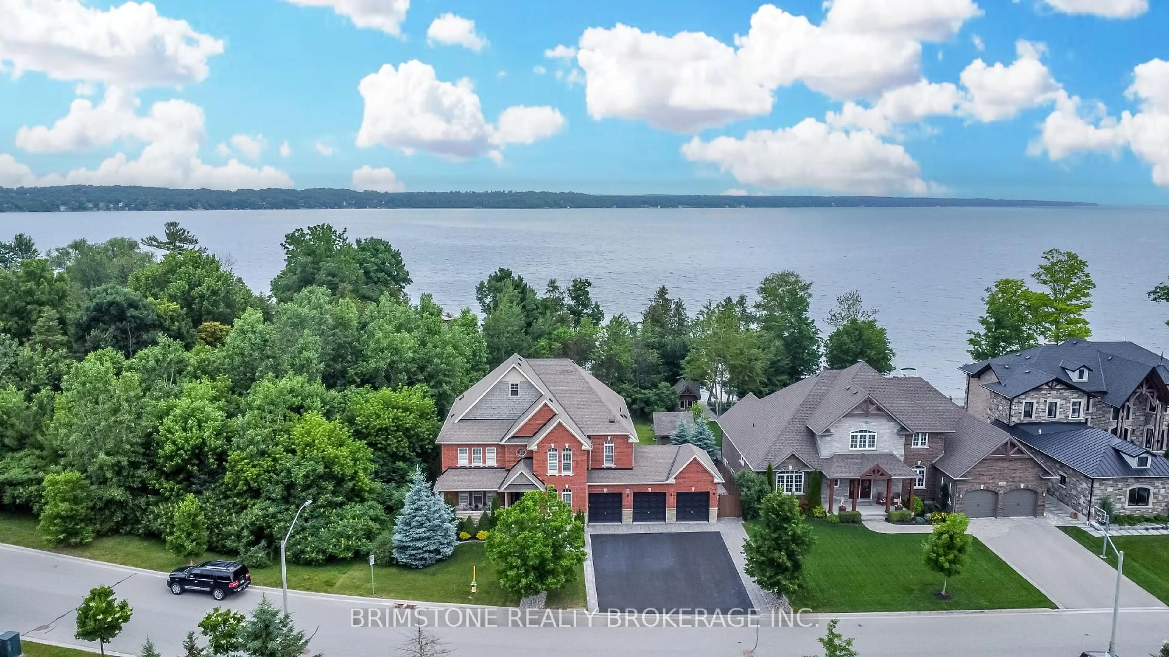 A pic from outside/outdoor area/front of a property/back of a property/a pic from drone, water/lake/river/ocean view for 31 Plunkett Crt, Barrie Ontario L4N 6M3