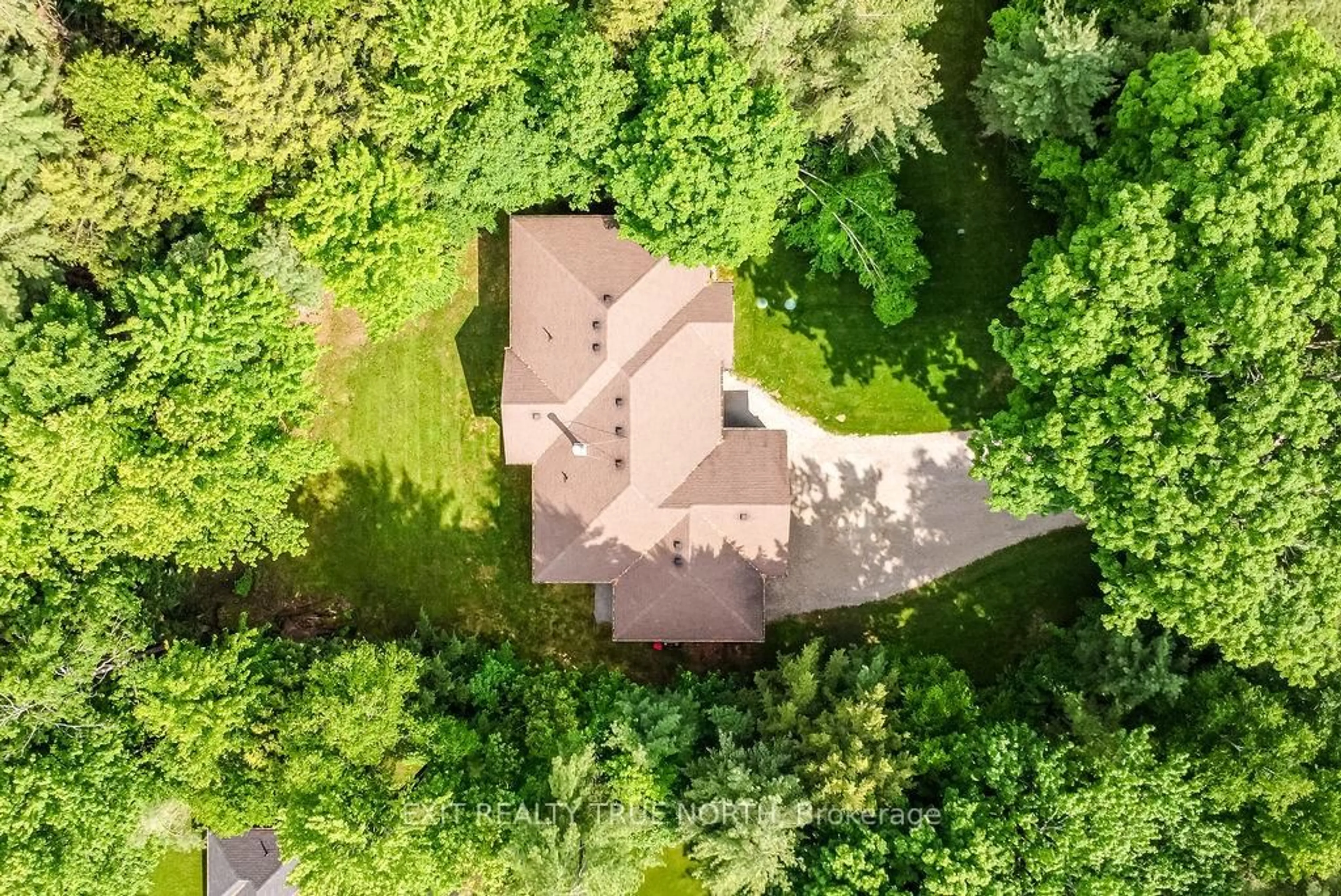 A pic from outside/outdoor area/front of a property/back of a property/a pic from drone, forest/trees view for 22 Marni Lane, Springwater Ontario L0L 2K0