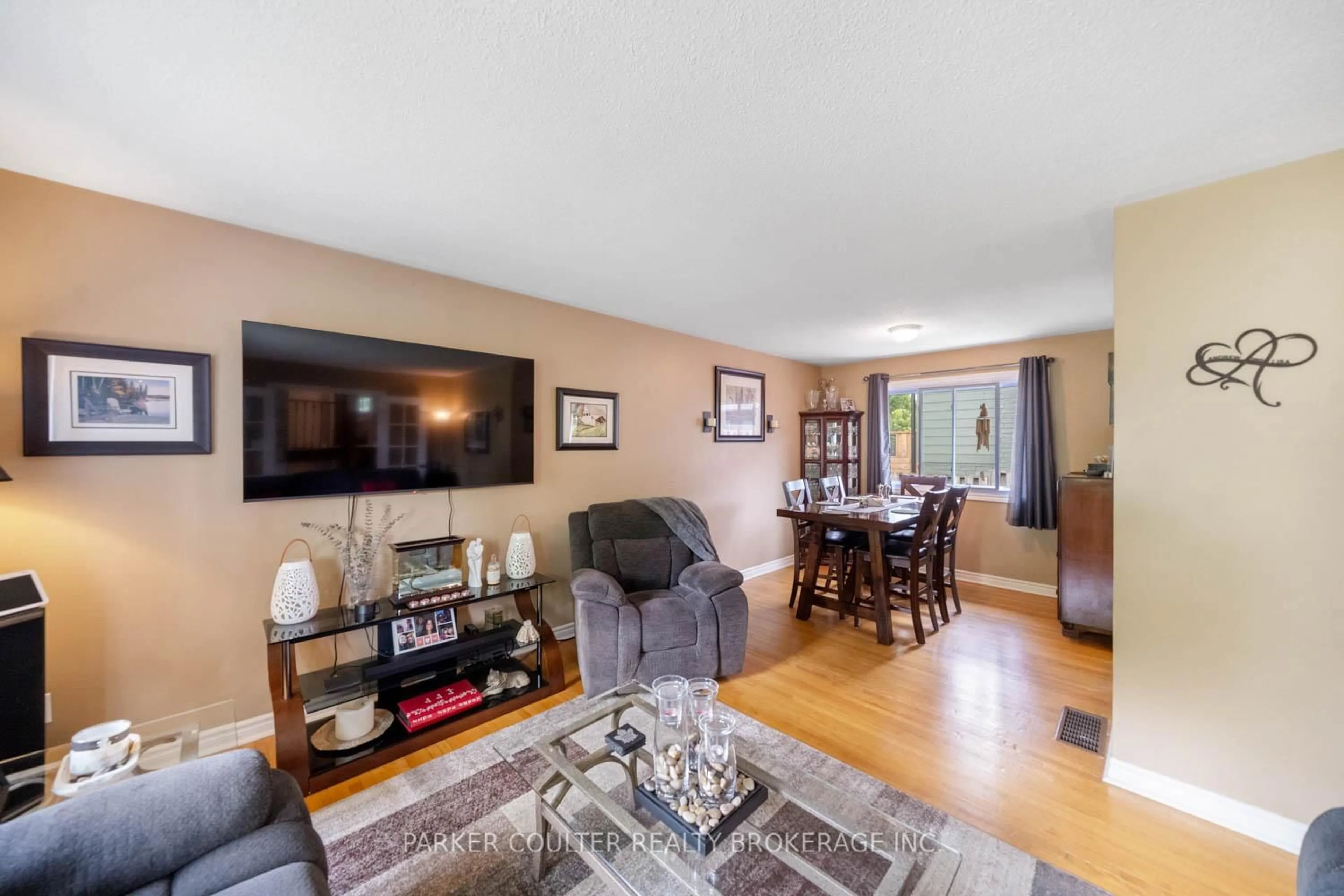 Living room with furniture, wood/laminate floor for 7 Broadmoor Ave, Barrie Ontario L4N 3N1