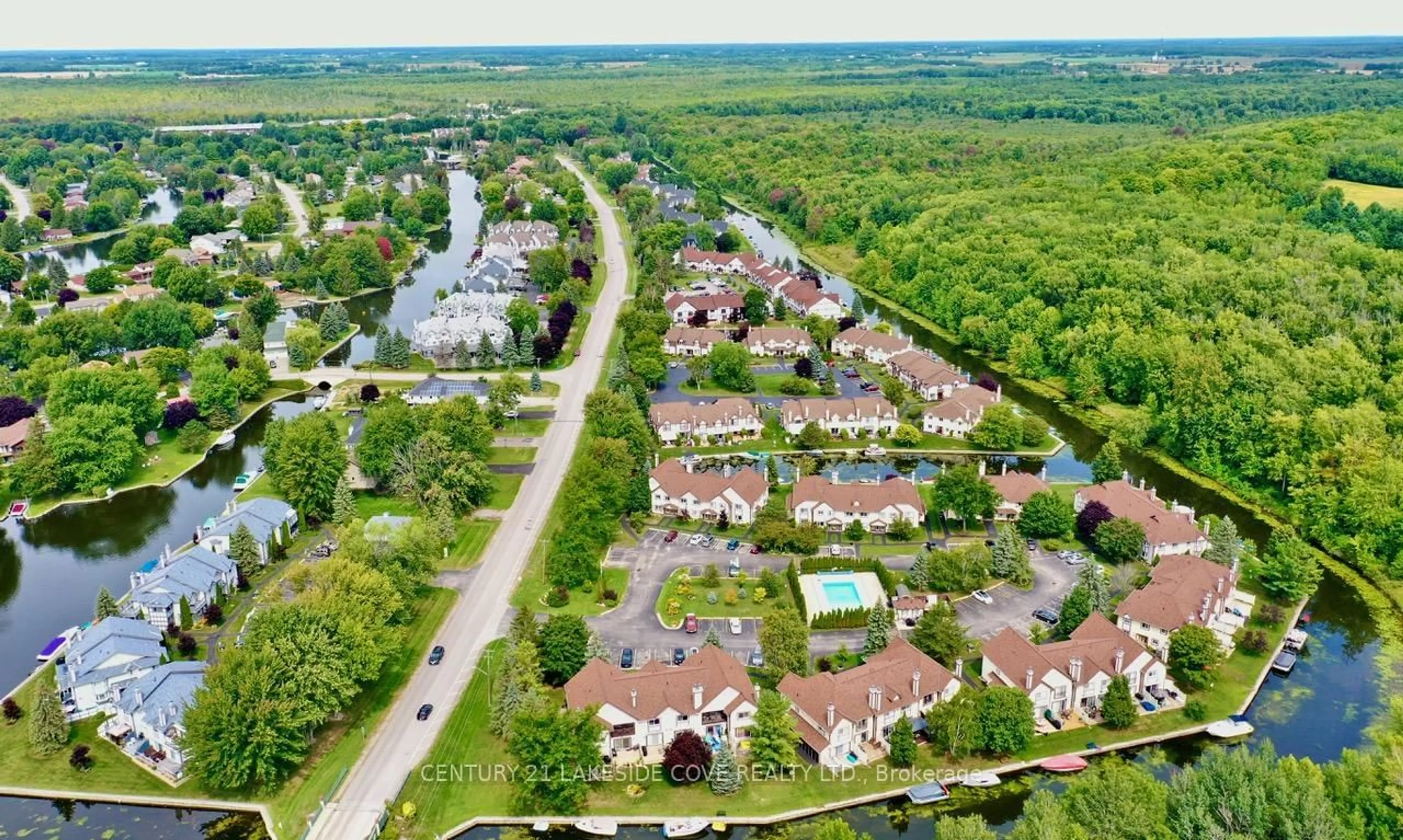 A pic from outside/outdoor area/front of a property/back of a property/a pic from drone, street for 11 Laguna Pkwy #Unit 36, Ramara Ontario L0K 1B0