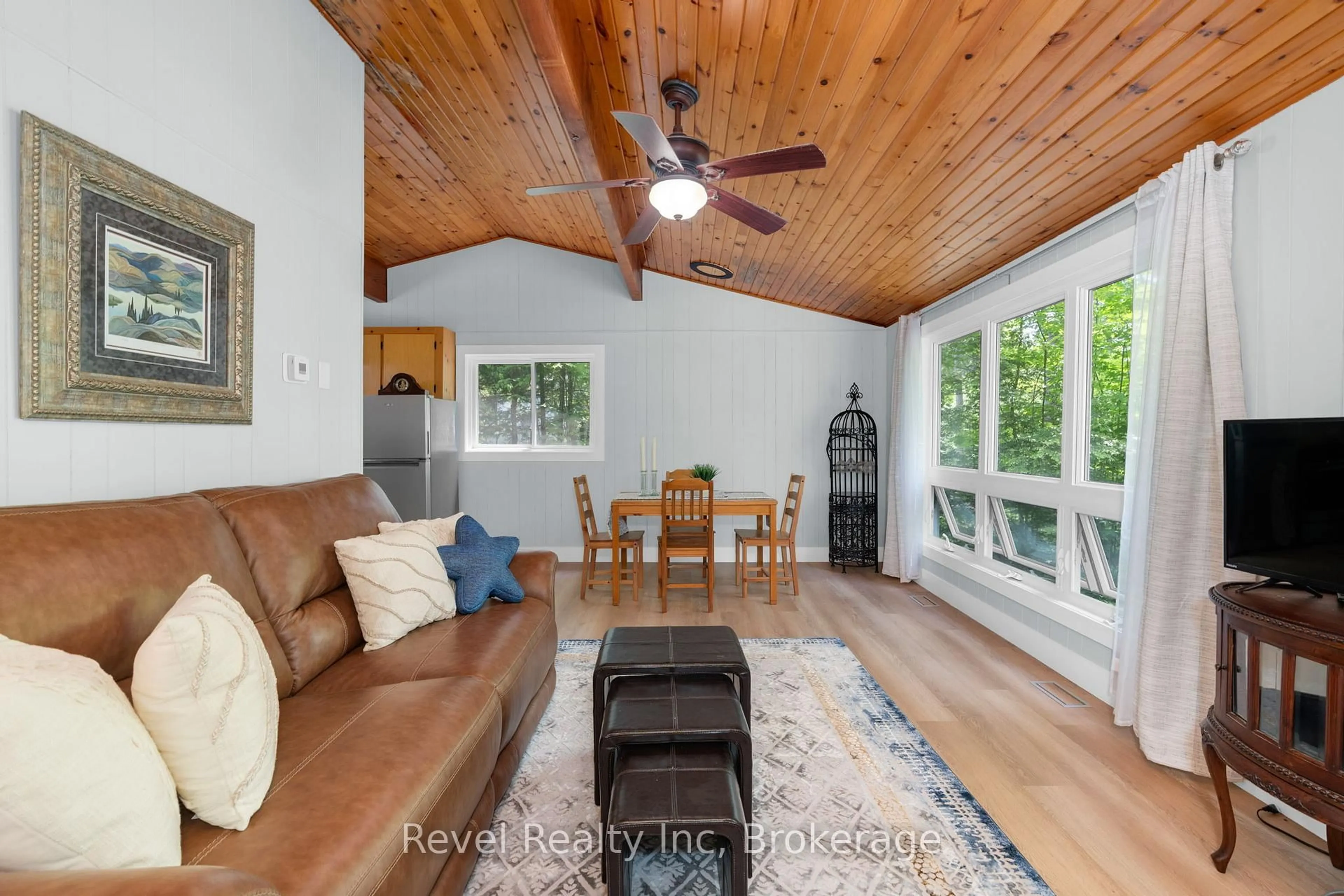 Living room with furniture, wood/laminate floor for 1204 Tiny Beaches Rd, Tiny Ontario L9M 0H7