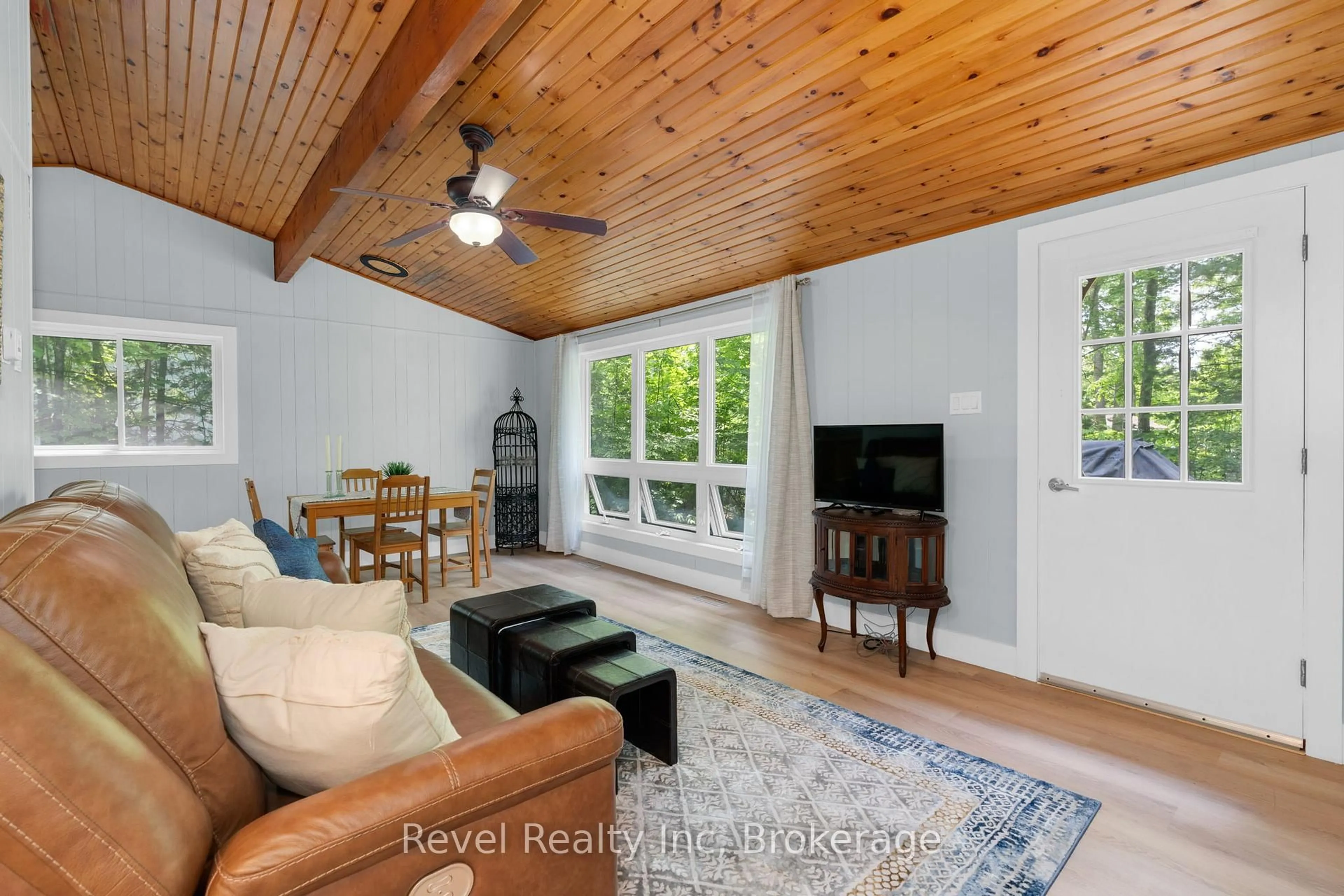 Living room with furniture, wood/laminate floor for 1204 Tiny Beaches Rd, Tiny Ontario L9M 0H7