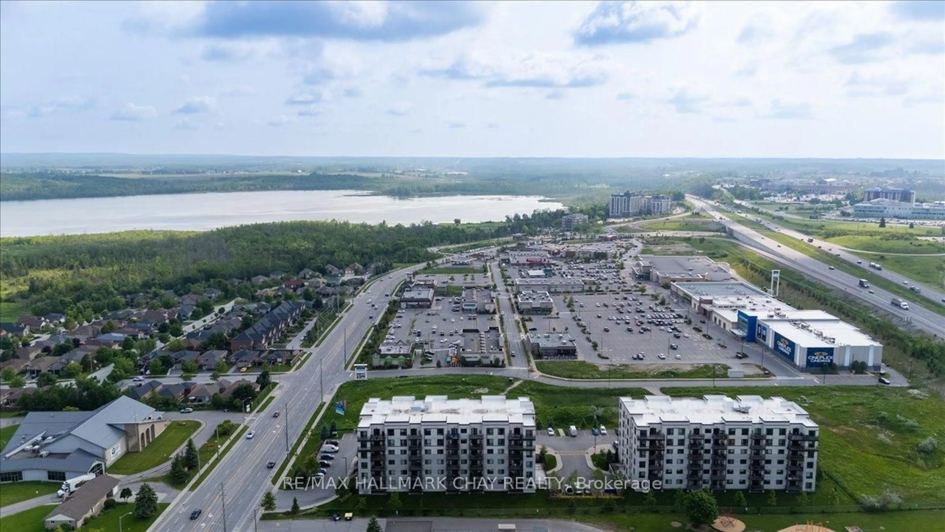 A pic from outside/outdoor area/front of a property/back of a property/a pic from drone, water/lake/river/ocean view for 295 Cundles Rd #404, Barrie Ontario L4M 0K8