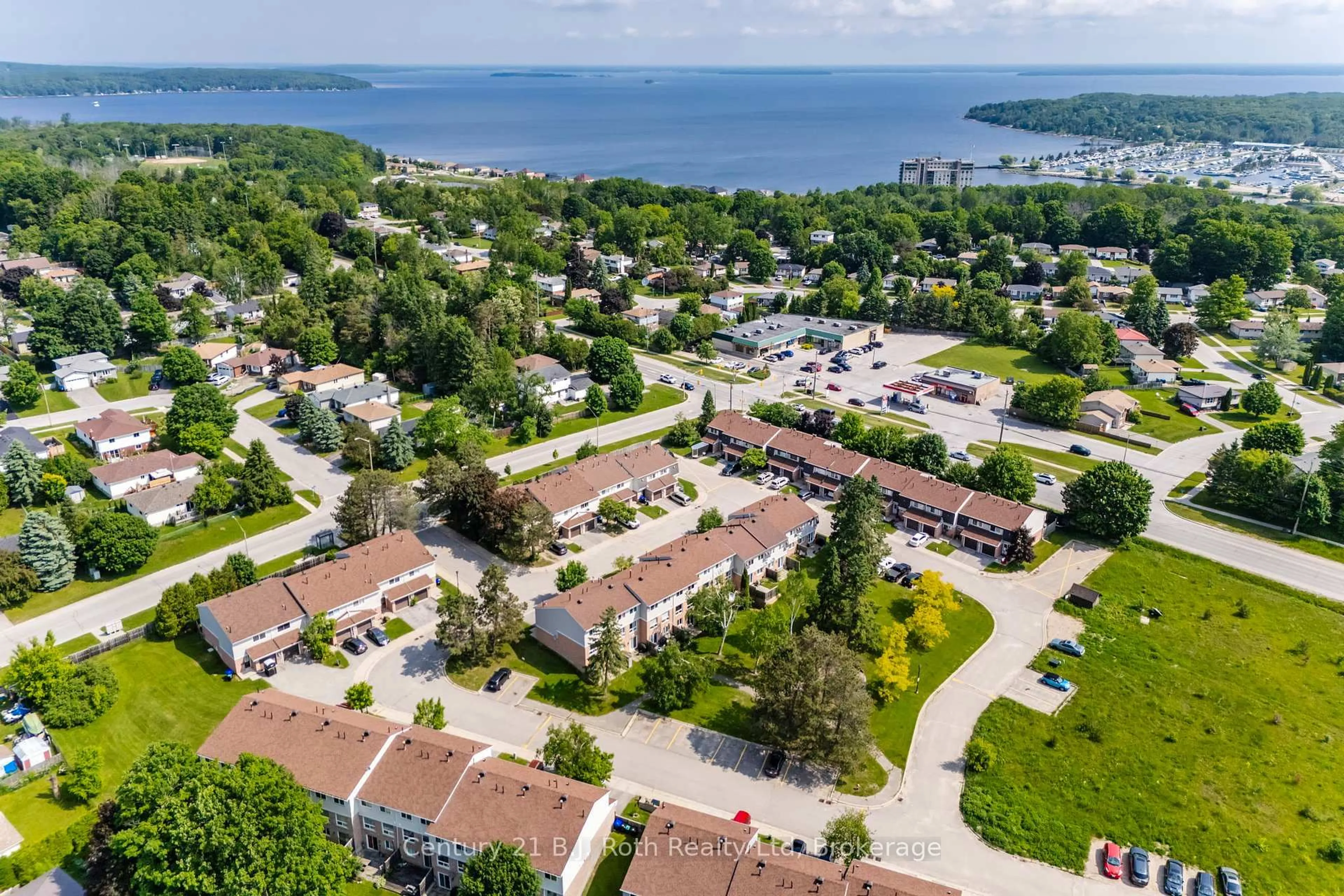A pic from outside/outdoor area/front of a property/back of a property/a pic from drone, water/lake/river/ocean view for 778 William St #71, Midland Ontario L4R 4R8