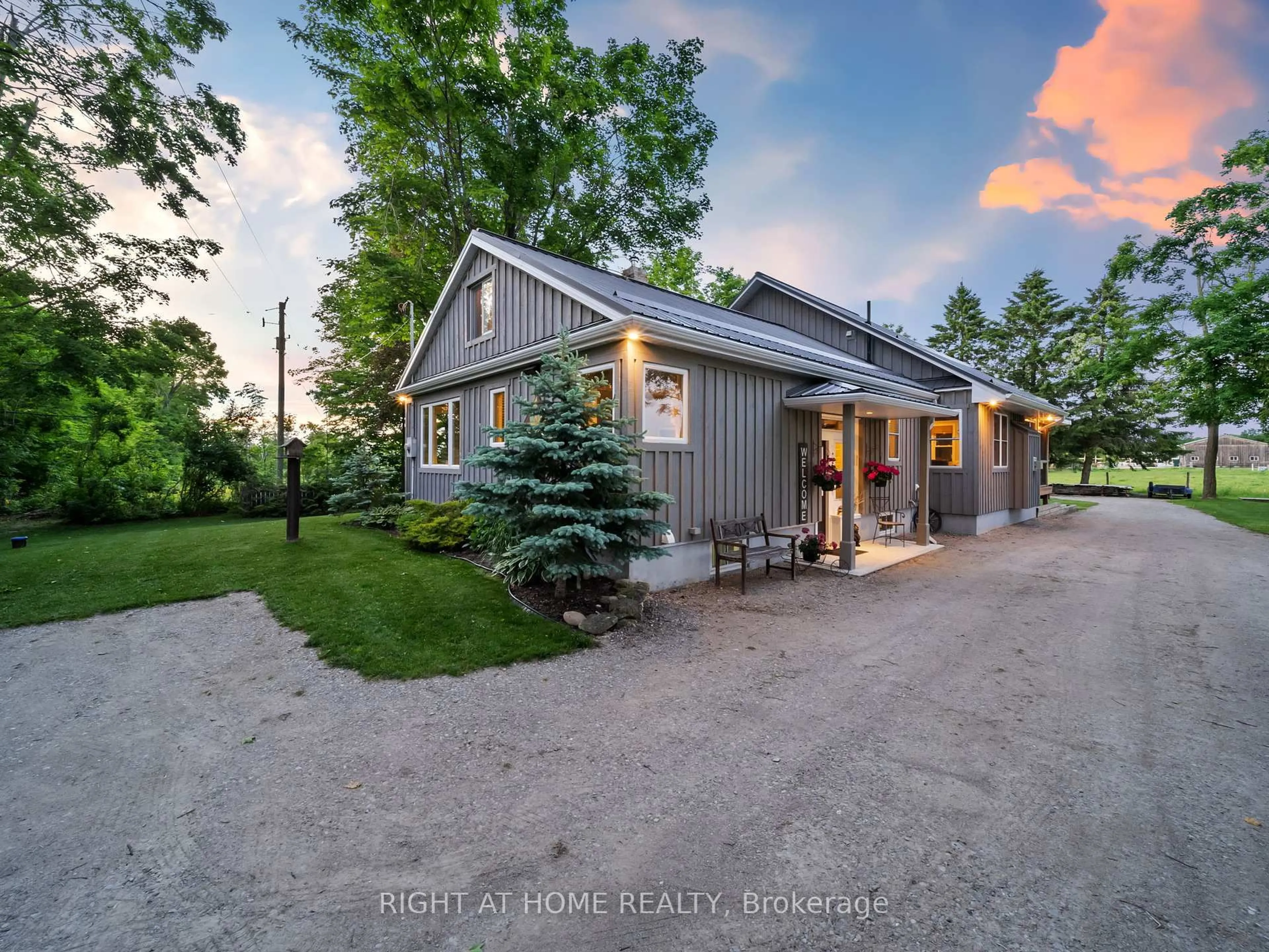 A pic from outside/outdoor area/front of a property/back of a property/a pic from drone, street for 1947 Russell Rd, Springwater Ontario L9X 1R5