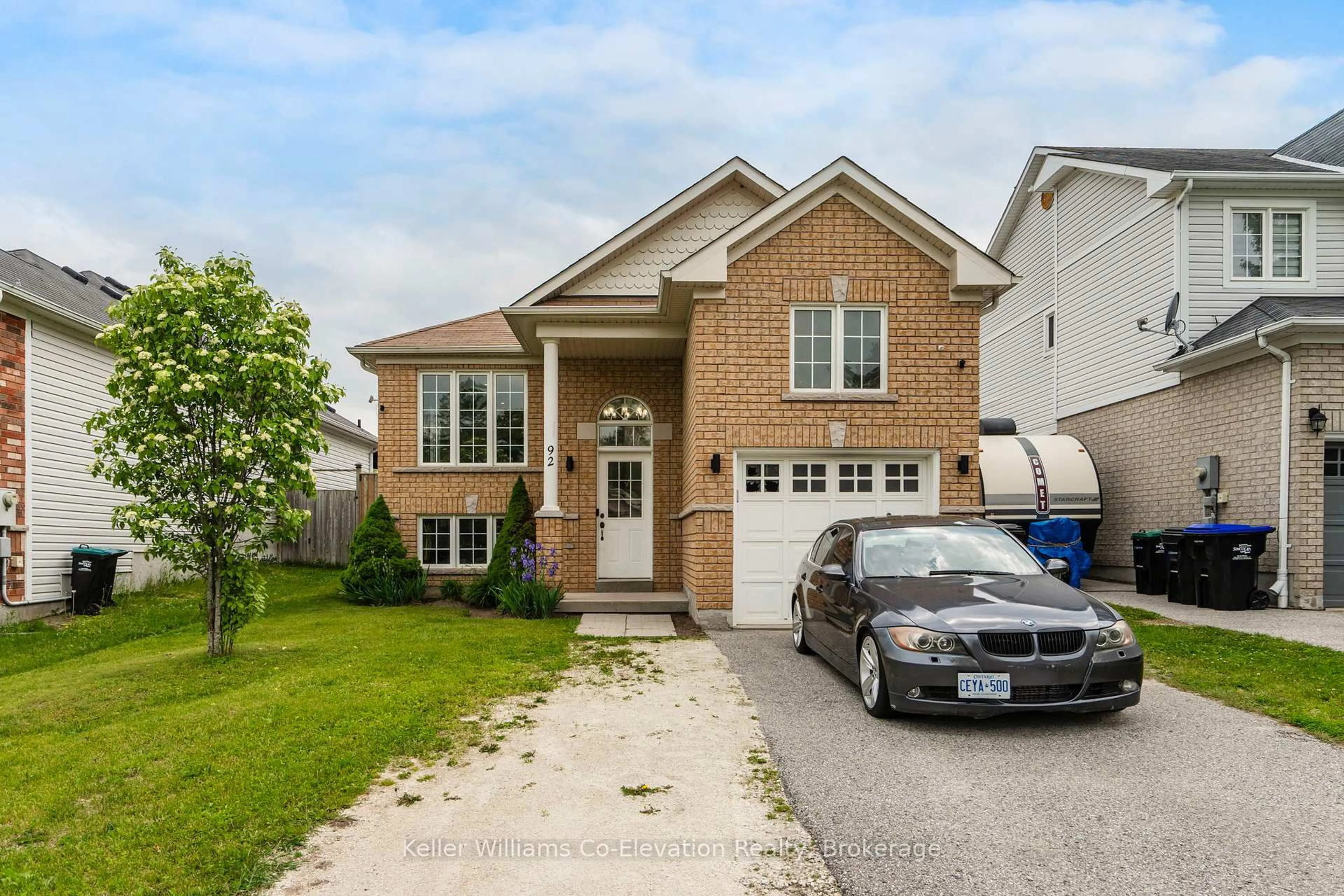 Home with brick exterior material, street for 92 Wesley Ave, Wasaga Beach Ontario L9Z 0B9