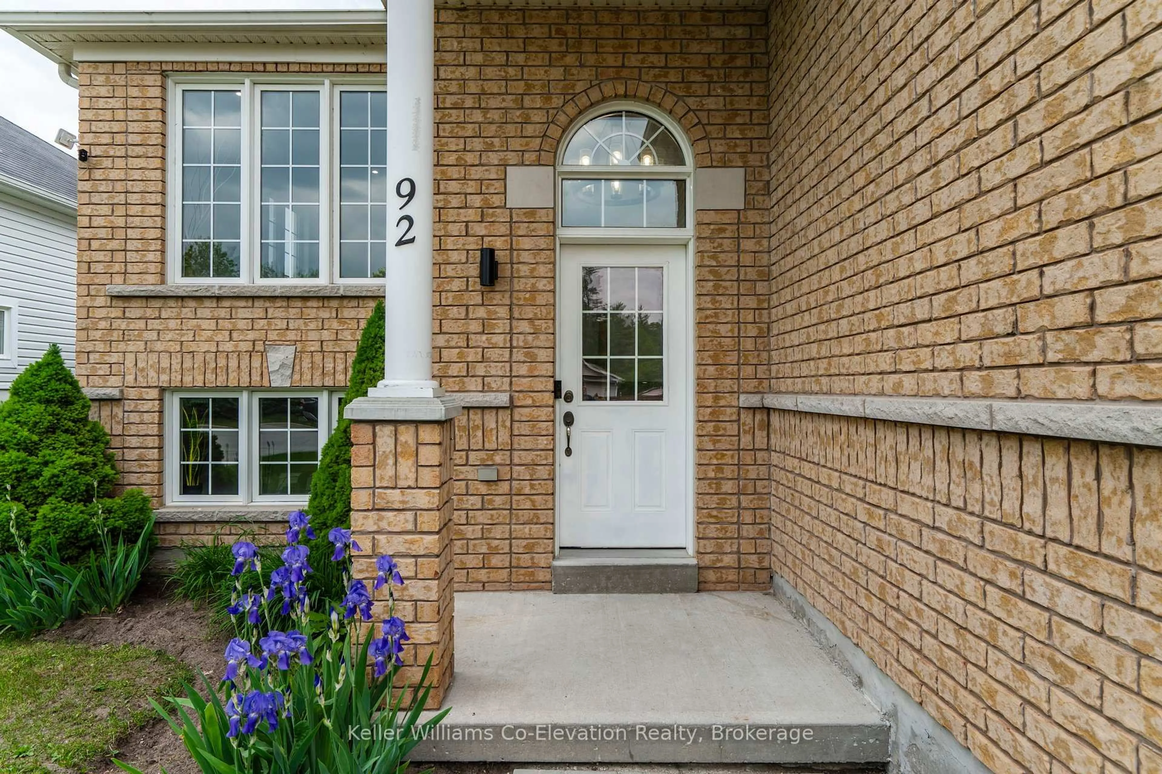 Home with brick exterior material, street for 92 Wesley Ave, Wasaga Beach Ontario L9Z 0B9