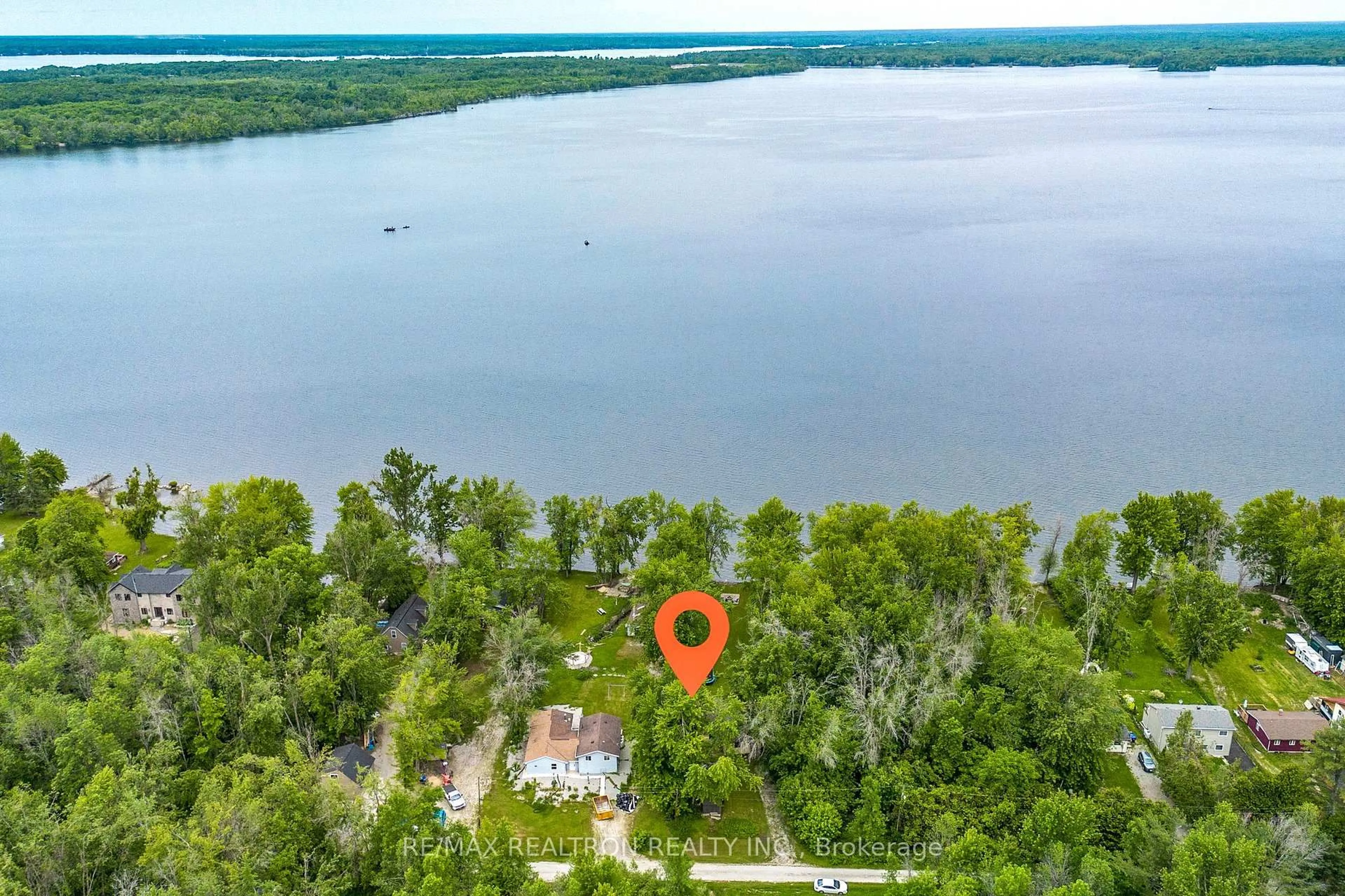 A pic from outside/outdoor area/front of a property/back of a property/a pic from drone, water/lake/river/ocean view for 6090 Sheba Dr, Ramara Ontario L3V 6H3