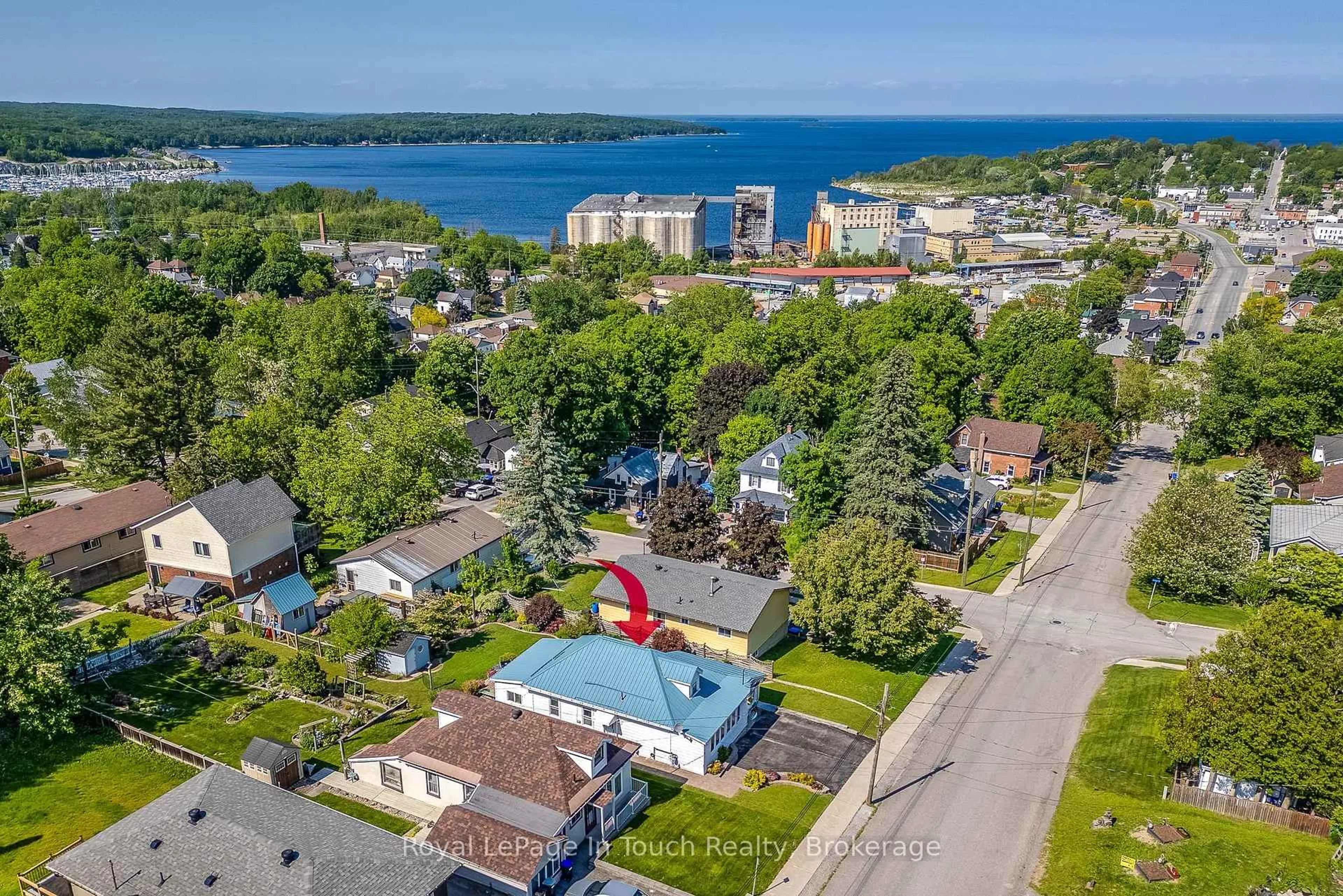 A pic from outside/outdoor area/front of a property/back of a property/a pic from drone, water/lake/river/ocean view for 710 Bay St, Midland Ontario L4R 1M2