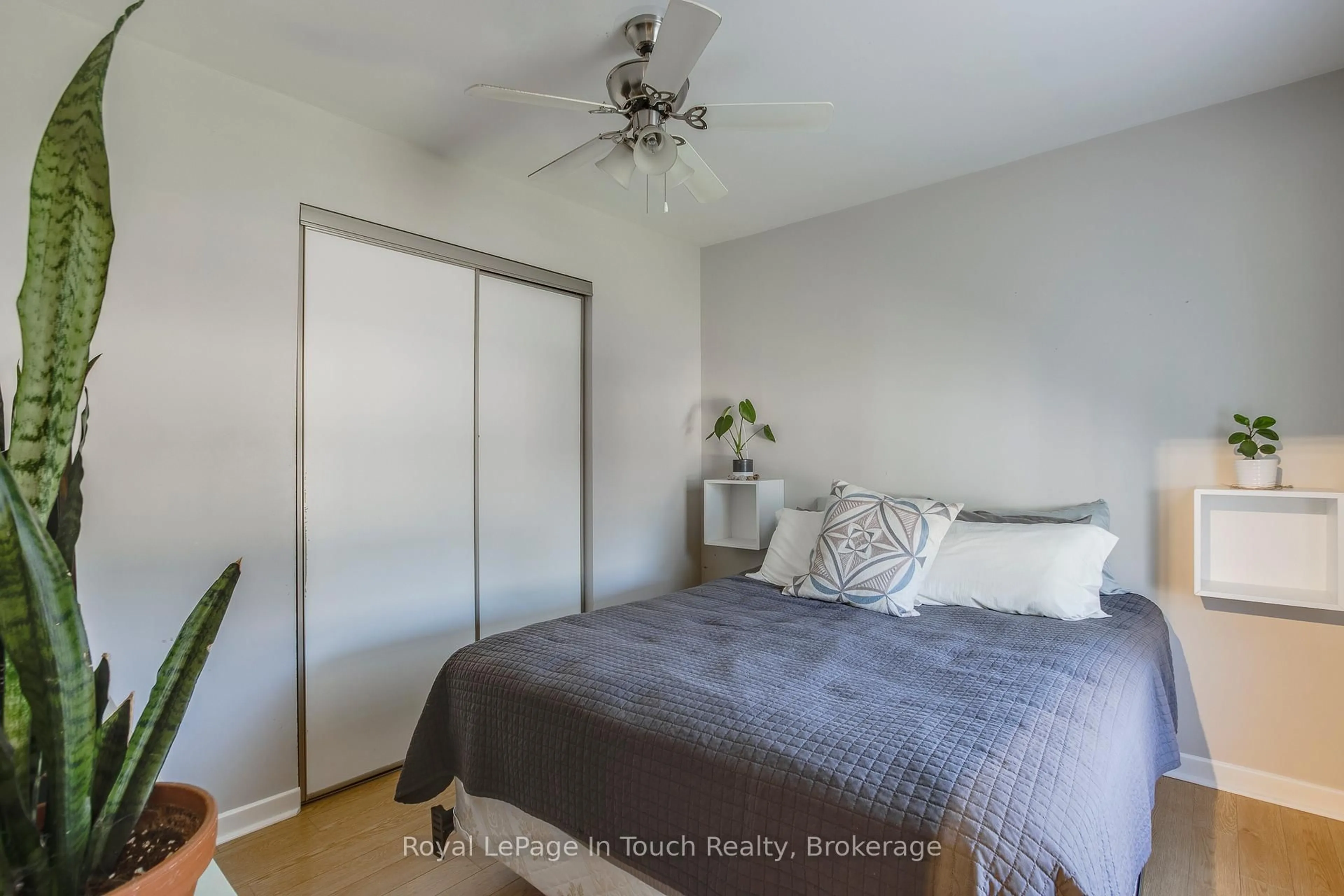 Bedroom with bed, wood/laminate floor for 710 Bay St, Midland Ontario L4R 1M2