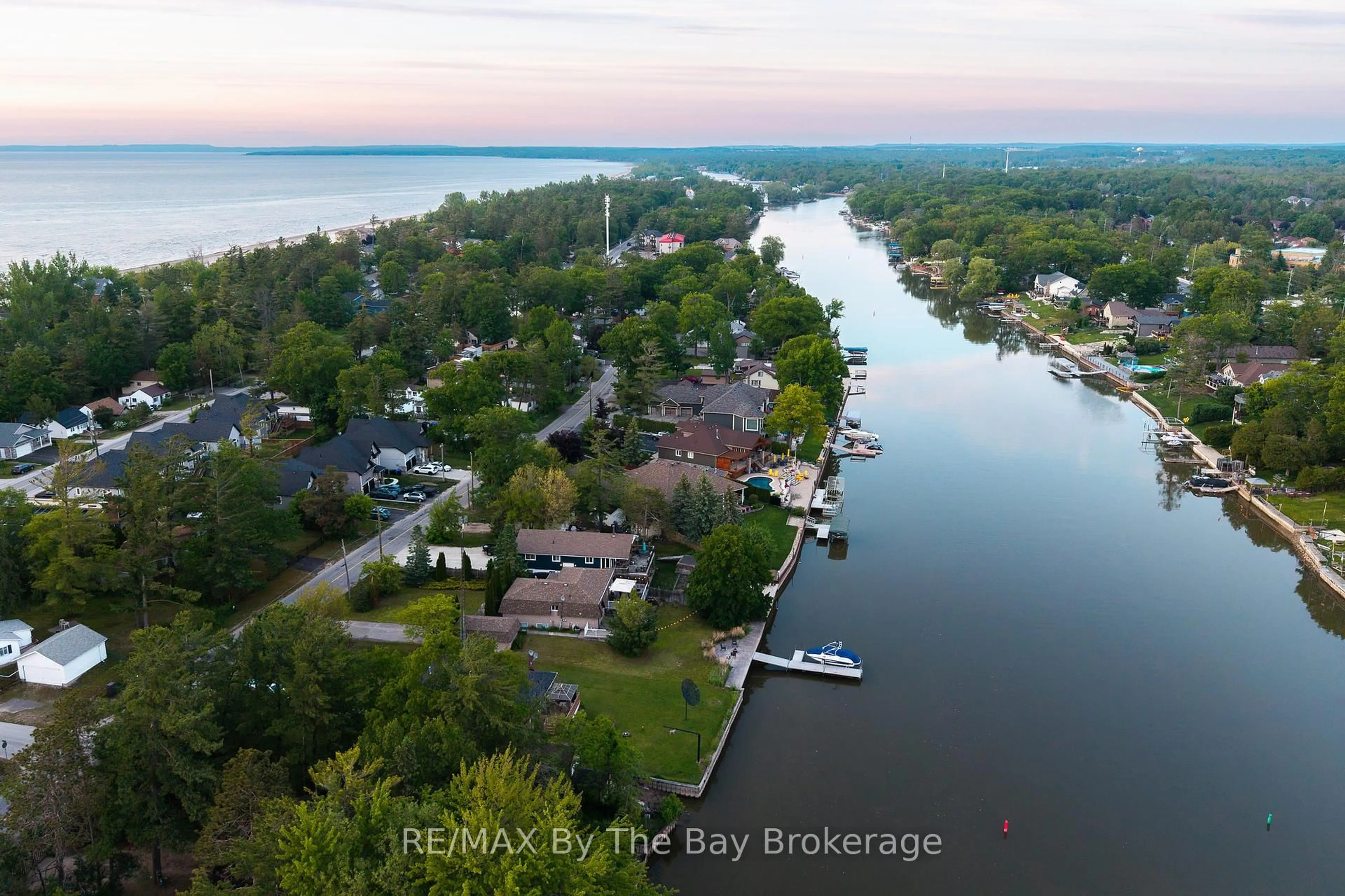 A pic from outside/outdoor area/front of a property/back of a property/a pic from drone, water/lake/river/ocean view for 83 OLD MOSLEY St, Wasaga Beach Ontario L9Z 2J5