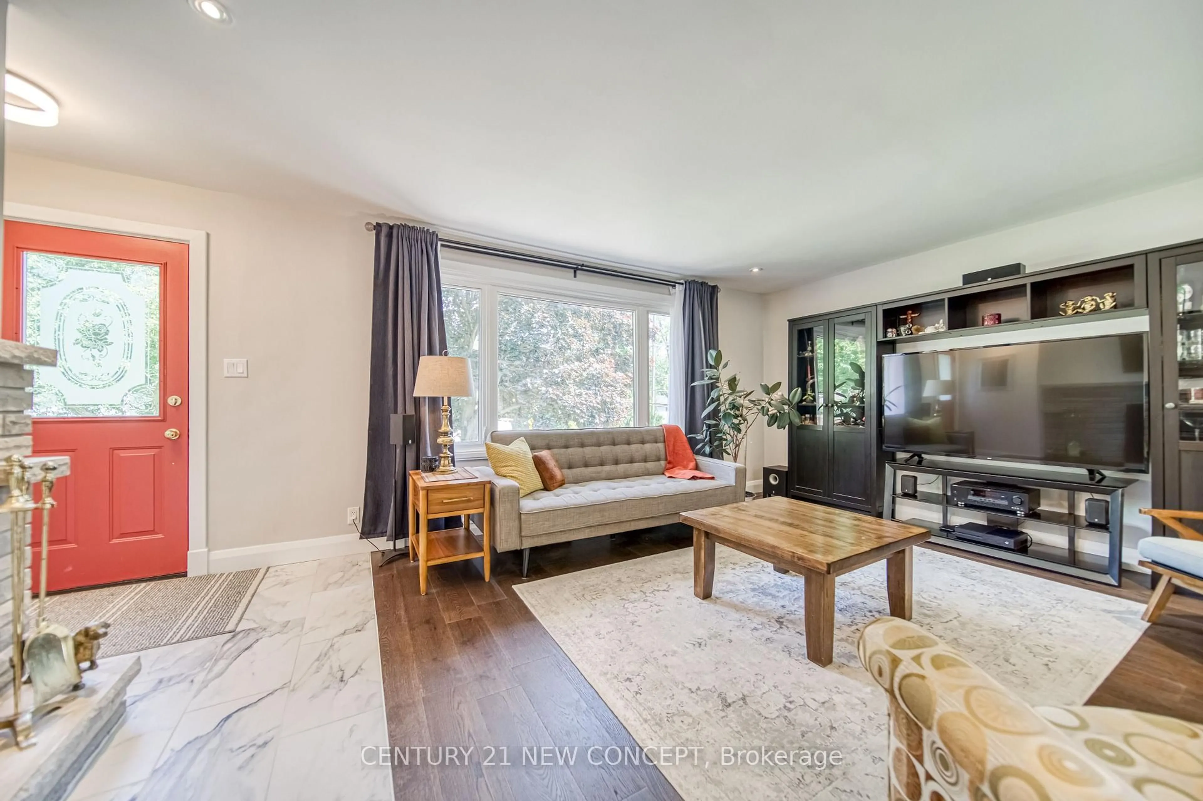 Living room with furniture, wood/laminate floor for 51 Fittons Rd, Orillia Ontario L3V 2J2