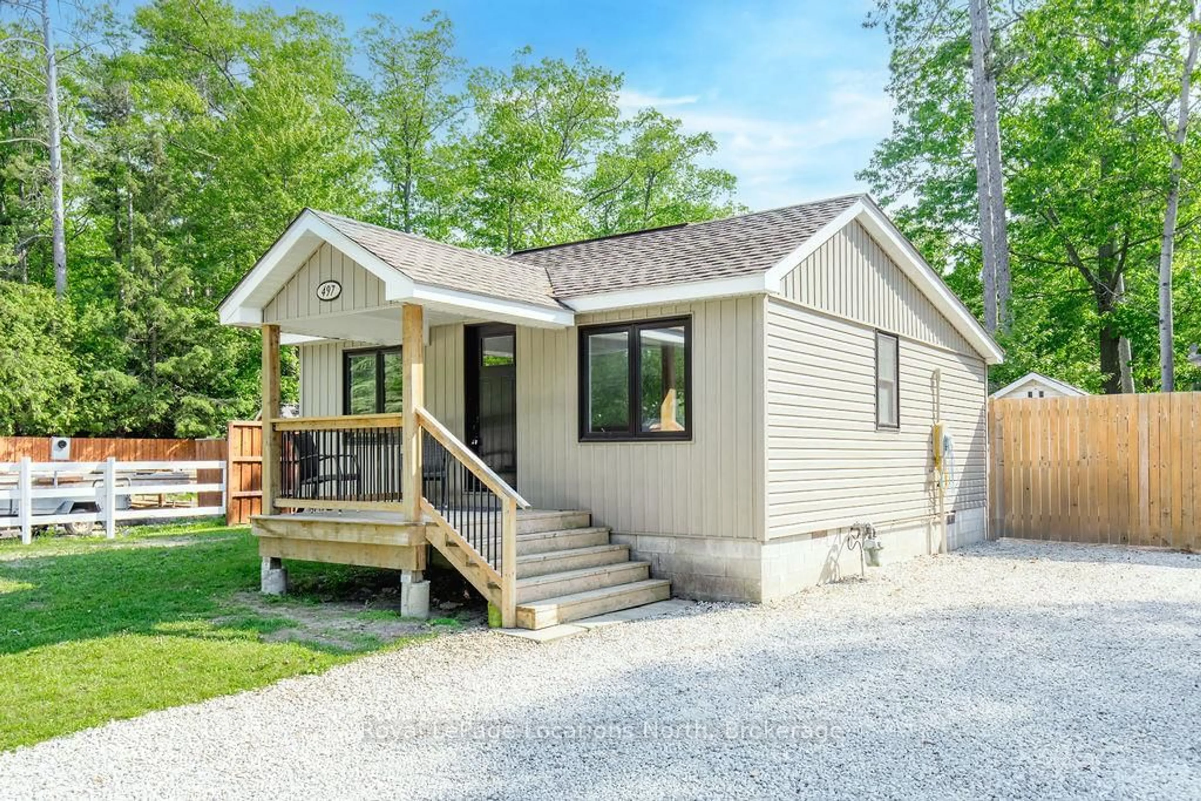 Home with vinyl exterior material, street for 497 OXBOW PARK Dr, Wasaga Beach Ontario L9Z 2T9