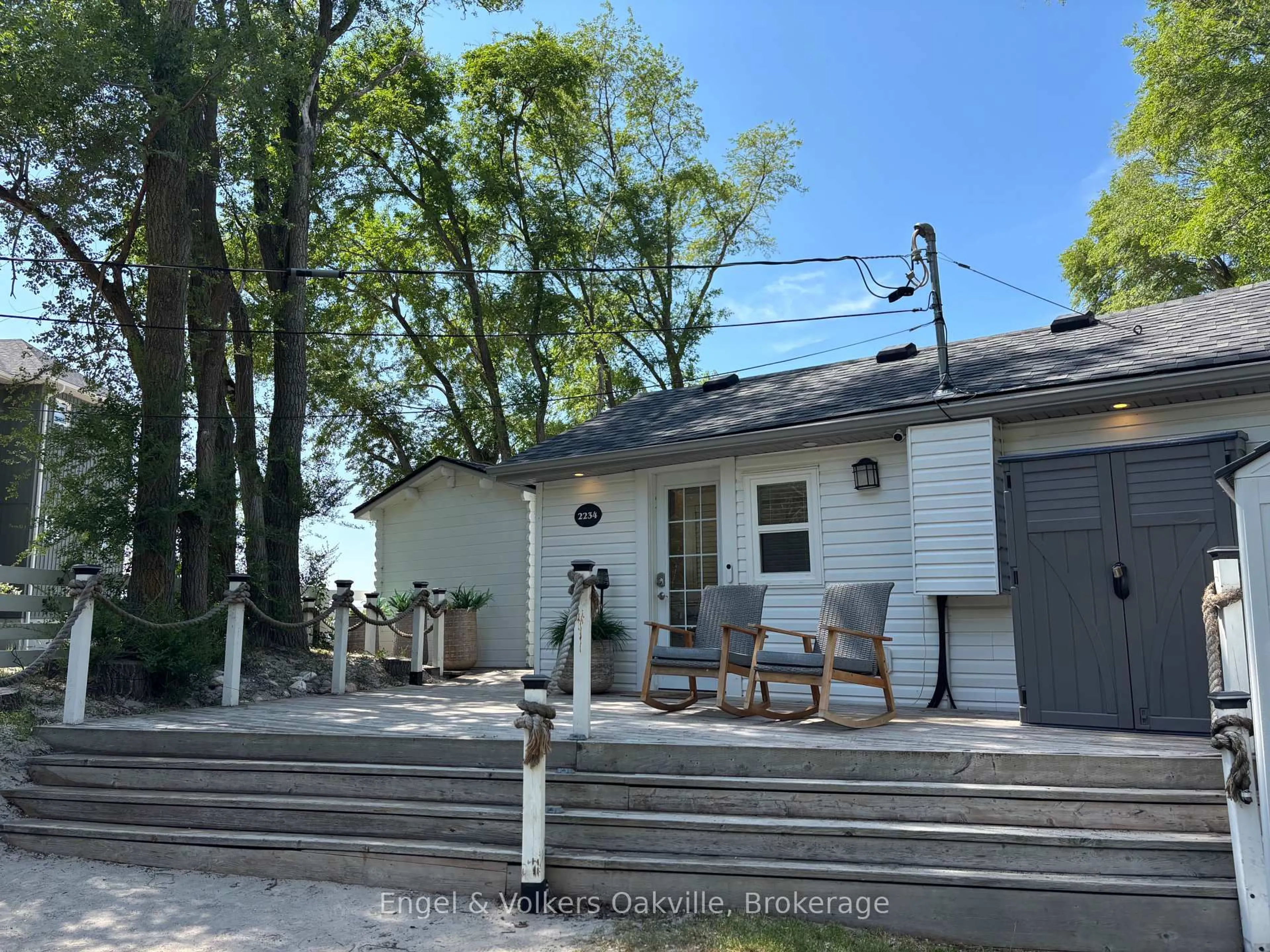 A pic from outside/outdoor area/front of a property/back of a property/a pic from drone, street for 2234 Tiny Beaches  Rd, Tiny Ontario L0L 1P1