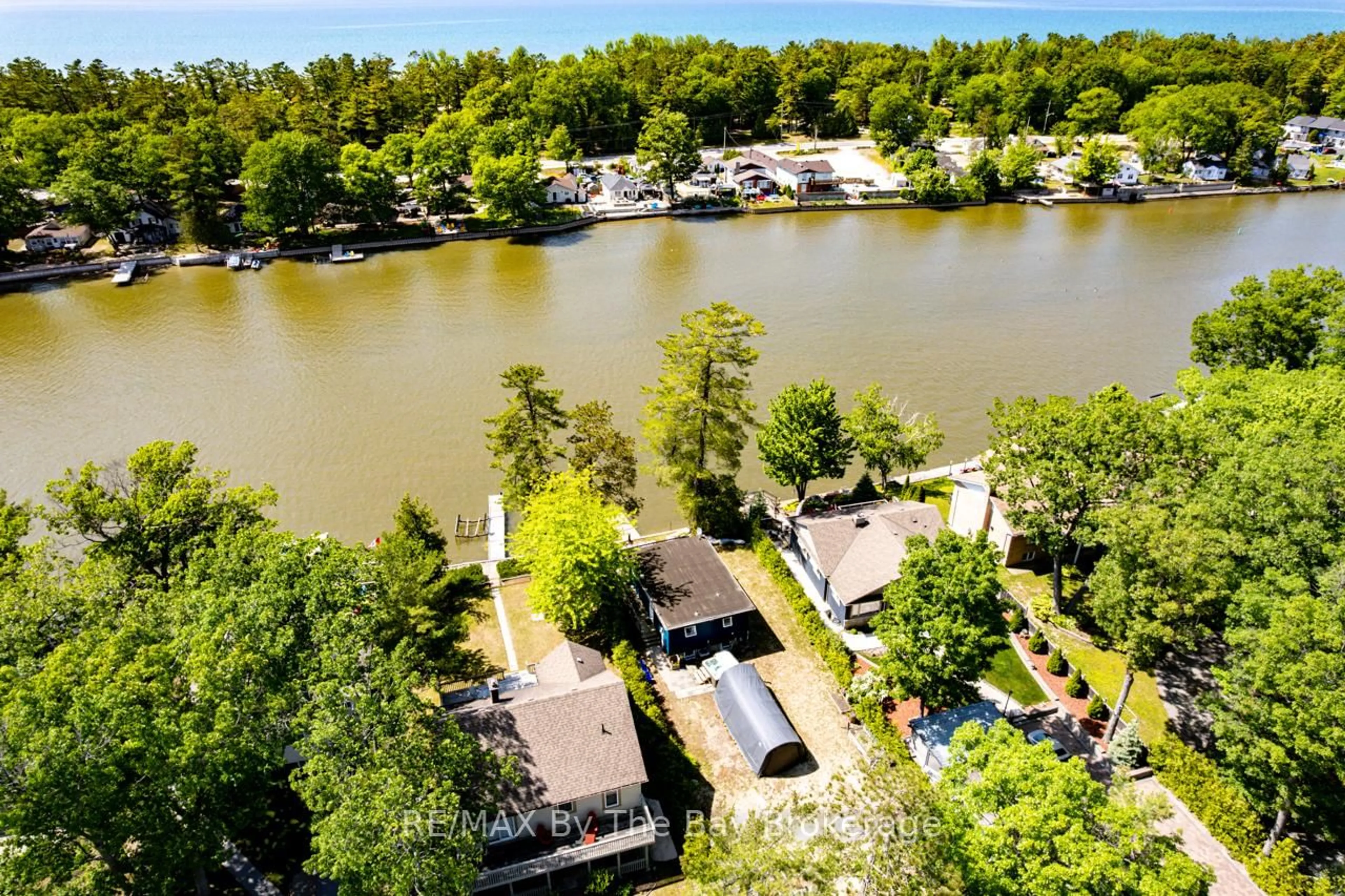 A pic from outside/outdoor area/front of a property/back of a property/a pic from drone, water/lake/river/ocean view for 1250 River Rd, Wasaga Beach Ontario L9Z 2W6