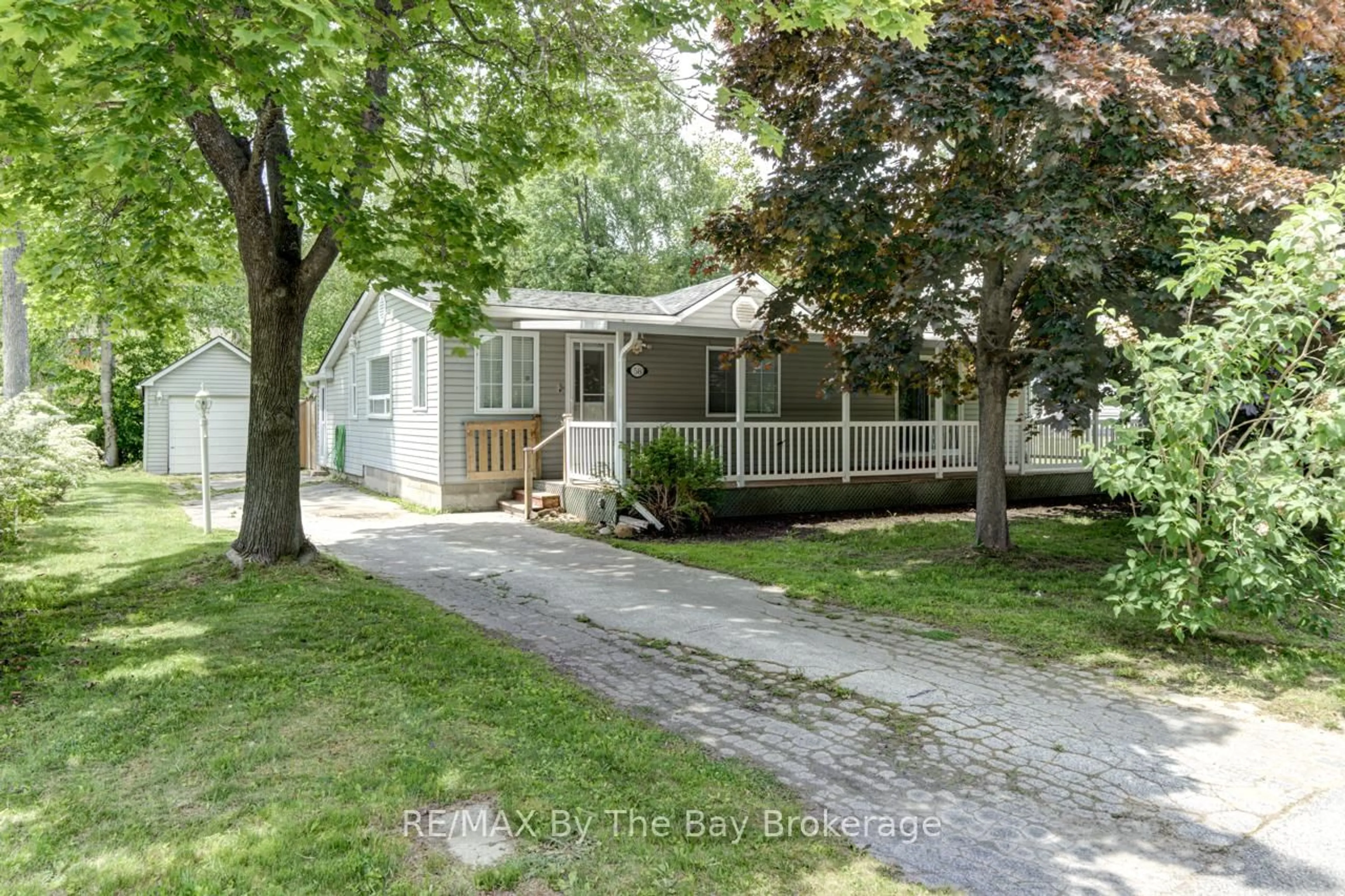 Home with vinyl exterior material, street for 58 47th St, Wasaga Beach Ontario L9Z 1Y6