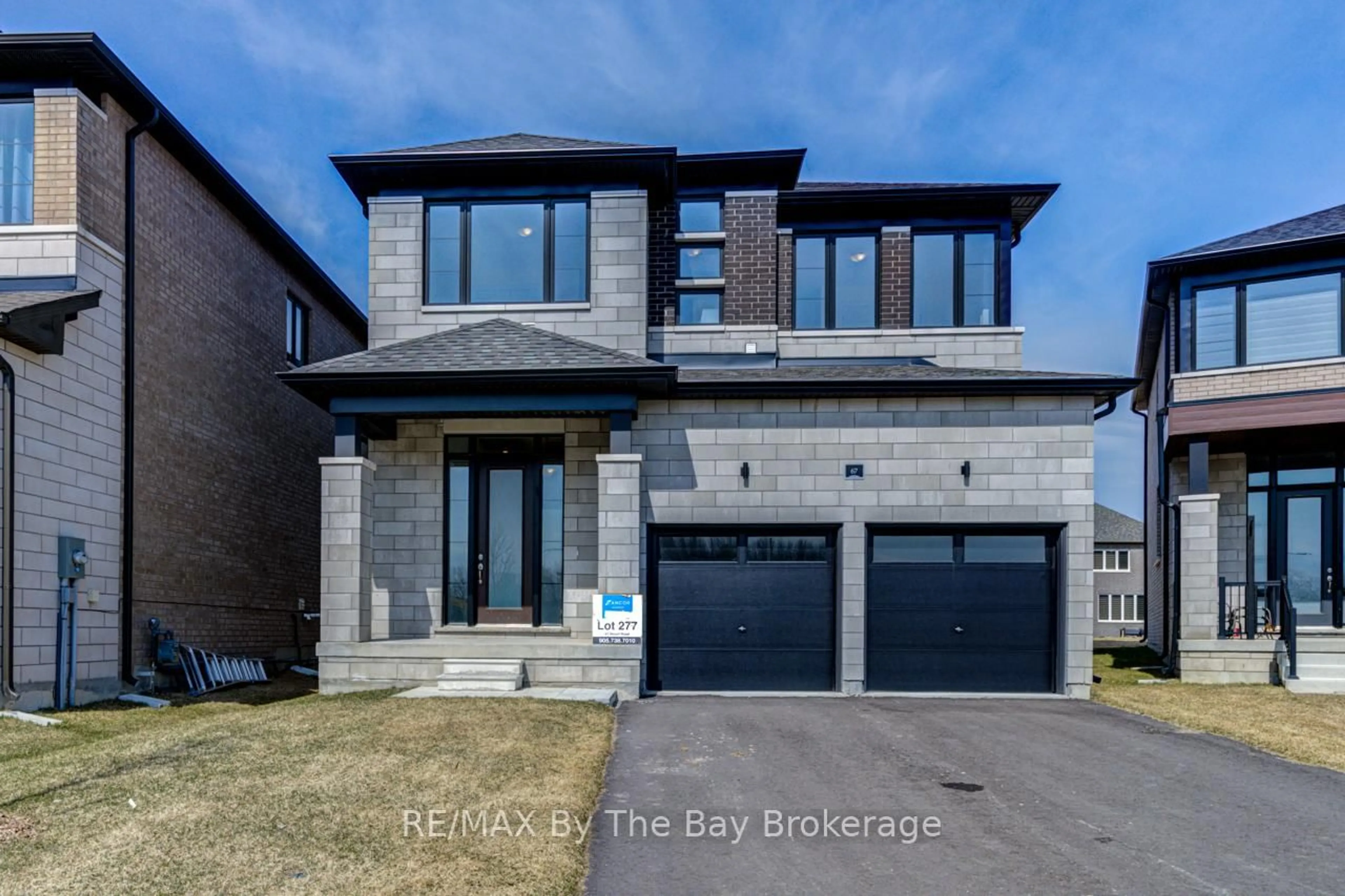 Home with brick exterior material, street for 67 Nicort Rd, Wasaga Beach Ontario L9Z 0N1