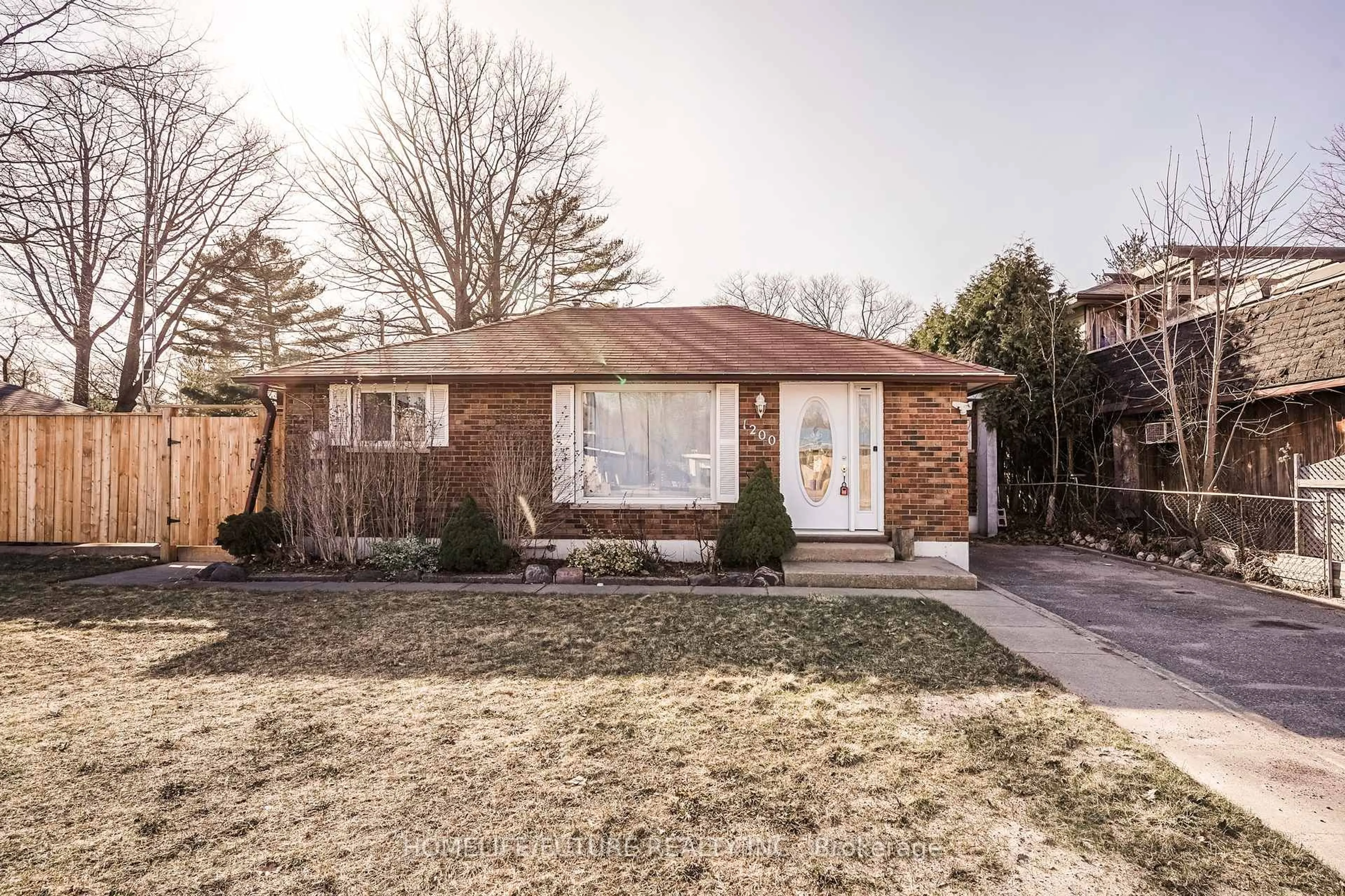 Home with brick exterior material, street for 1200 Mosley St, Wasaga Beach Ontario L9Z 2E7