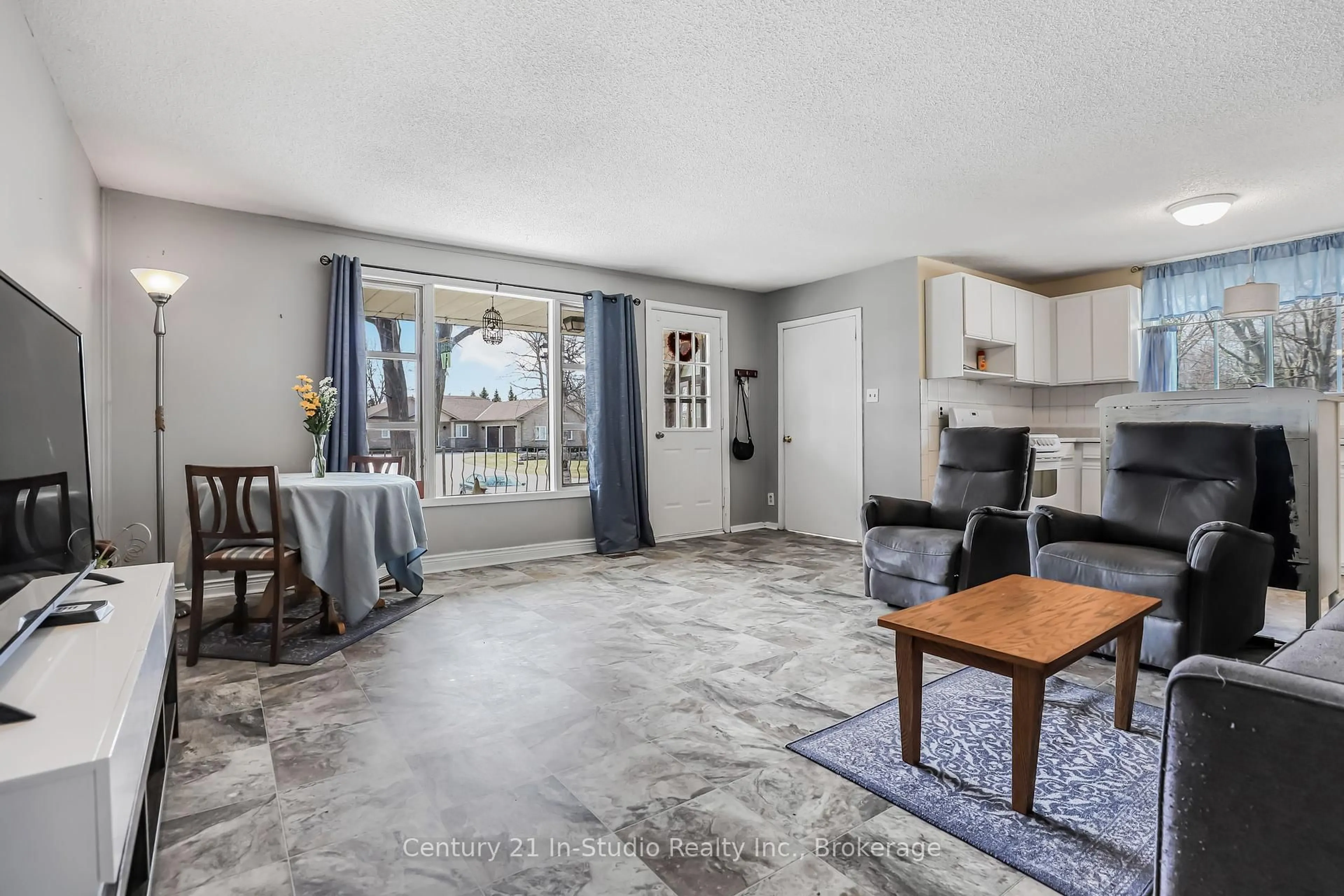 Living room with furniture, ceramic/tile floor for 152 Frederick Dr, Wasaga Beach Ontario L9Z 1P1
