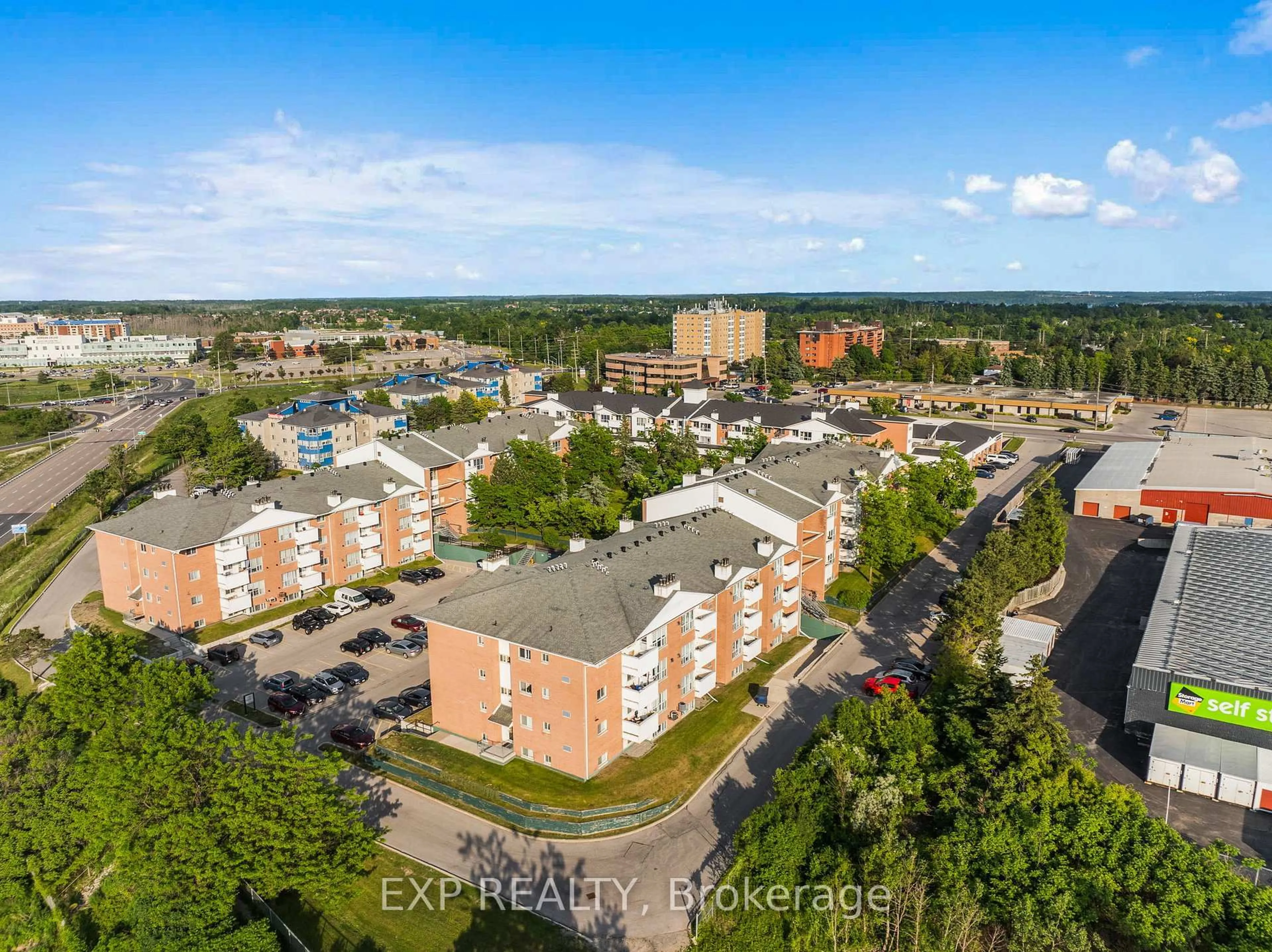 A pic from outside/outdoor area/front of a property/back of a property/a pic from drone, city buildings view from balcony for 120 Bell Farm Rd #201, Barrie Ontario L4M 6J2
