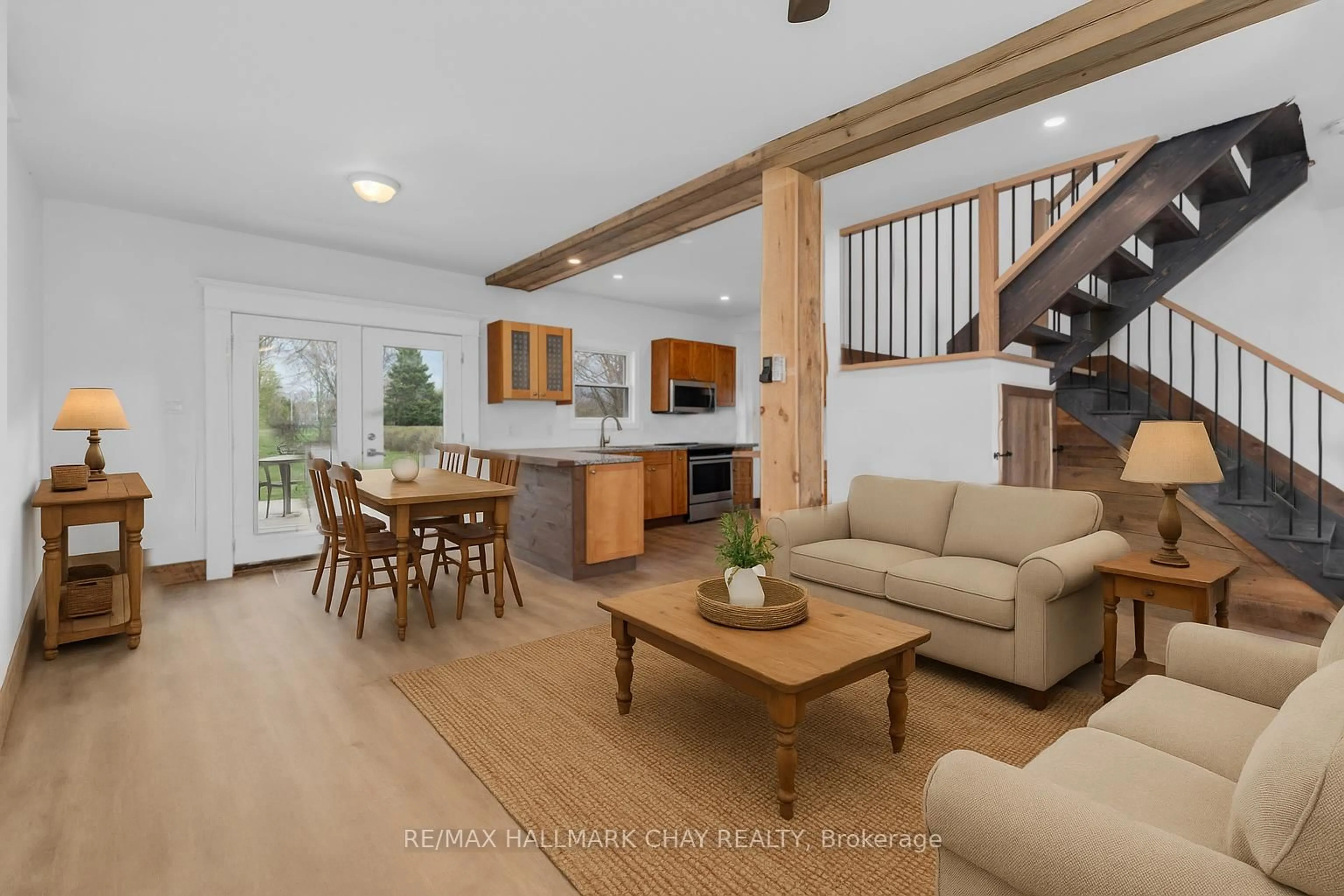 Open concept kitchen, wood/laminate floor for 17 County Road 6 Rd, Tiny Ontario L0L 2J0