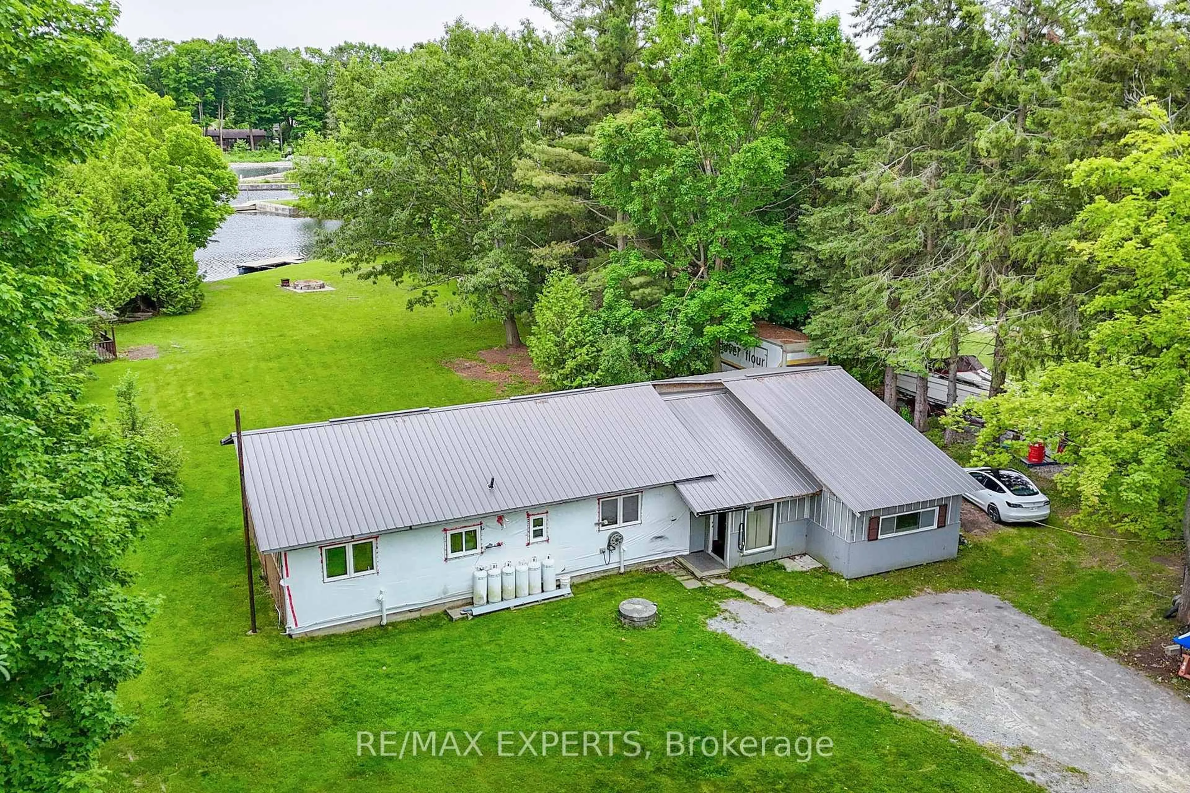 A pic from outside/outdoor area/front of a property/back of a property/a pic from drone, water/lake/river/ocean view for 1401 Canal Rd #ON, Ramara Ontario L0K 1B0