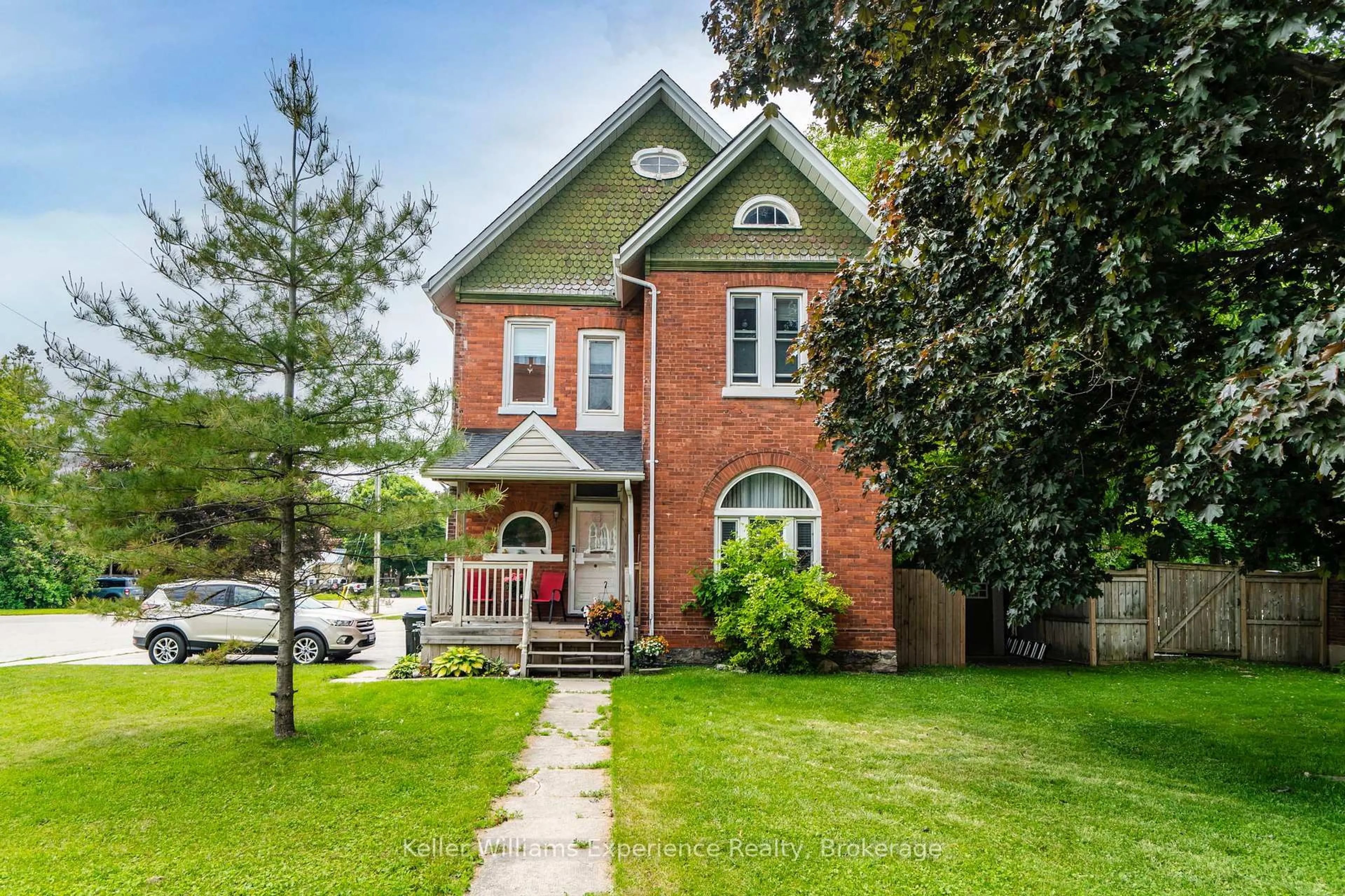 Home with brick exterior material, street for 20 Yonge St, Springwater Ontario L0L 1P0