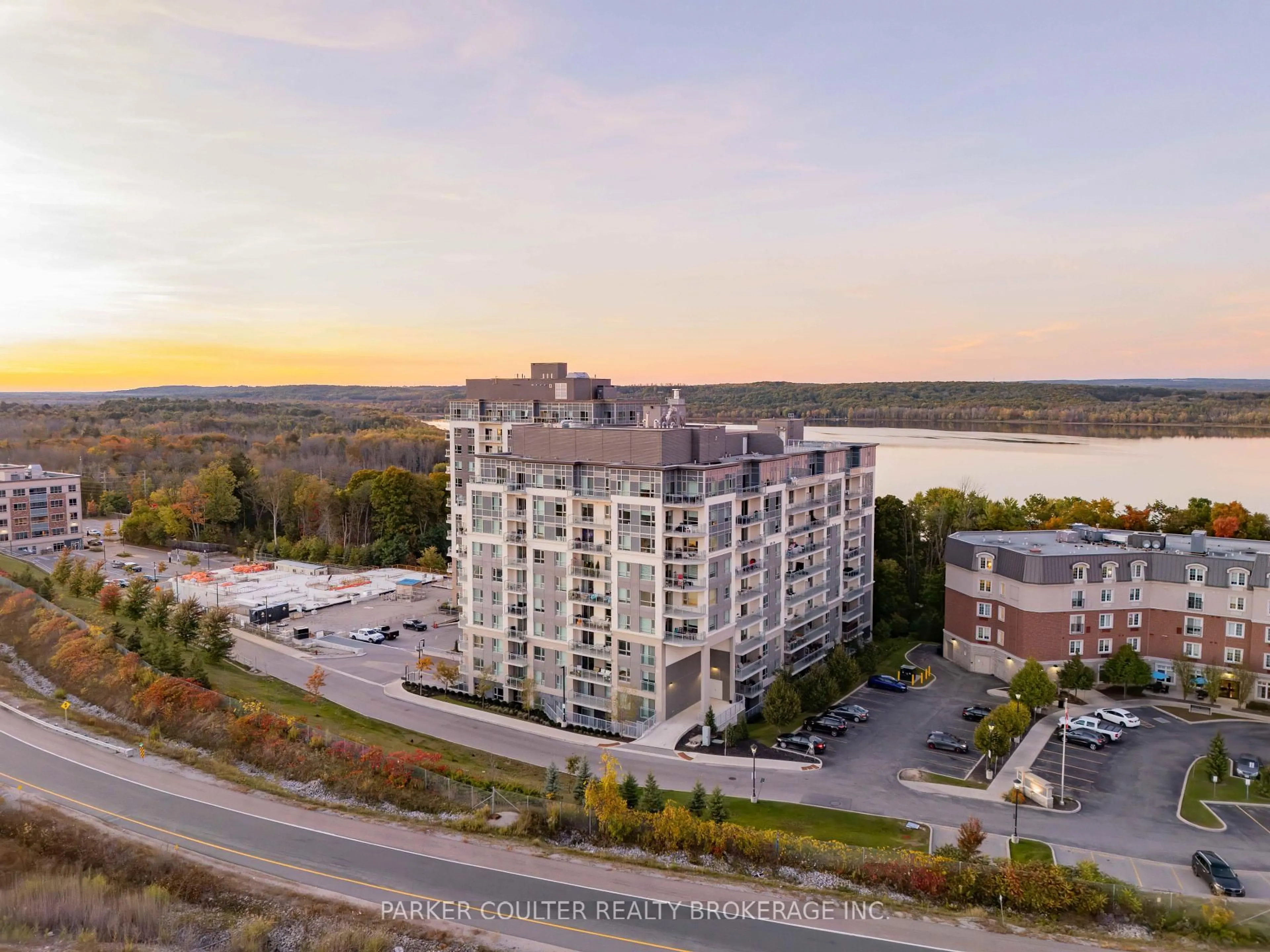 A pic from outside/outdoor area/front of a property/back of a property/a pic from drone, water/lake/river/ocean view for 58 Lakeside Terr #207, Barrie Ontario L4M 0L5