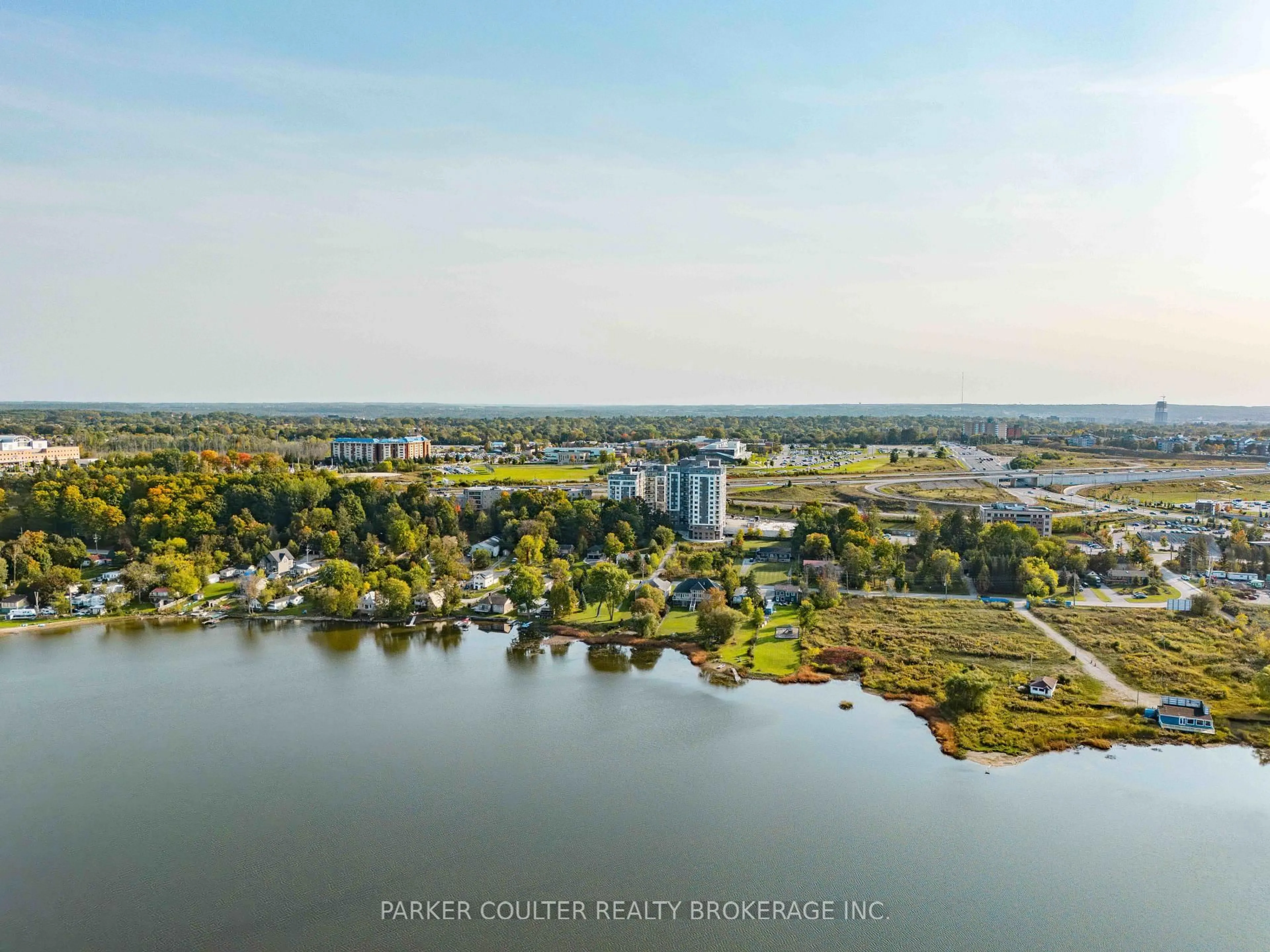 A pic from outside/outdoor area/front of a property/back of a property/a pic from drone, water/lake/river/ocean view for 58 Lakeside Terr #207, Barrie Ontario L4M 0L5
