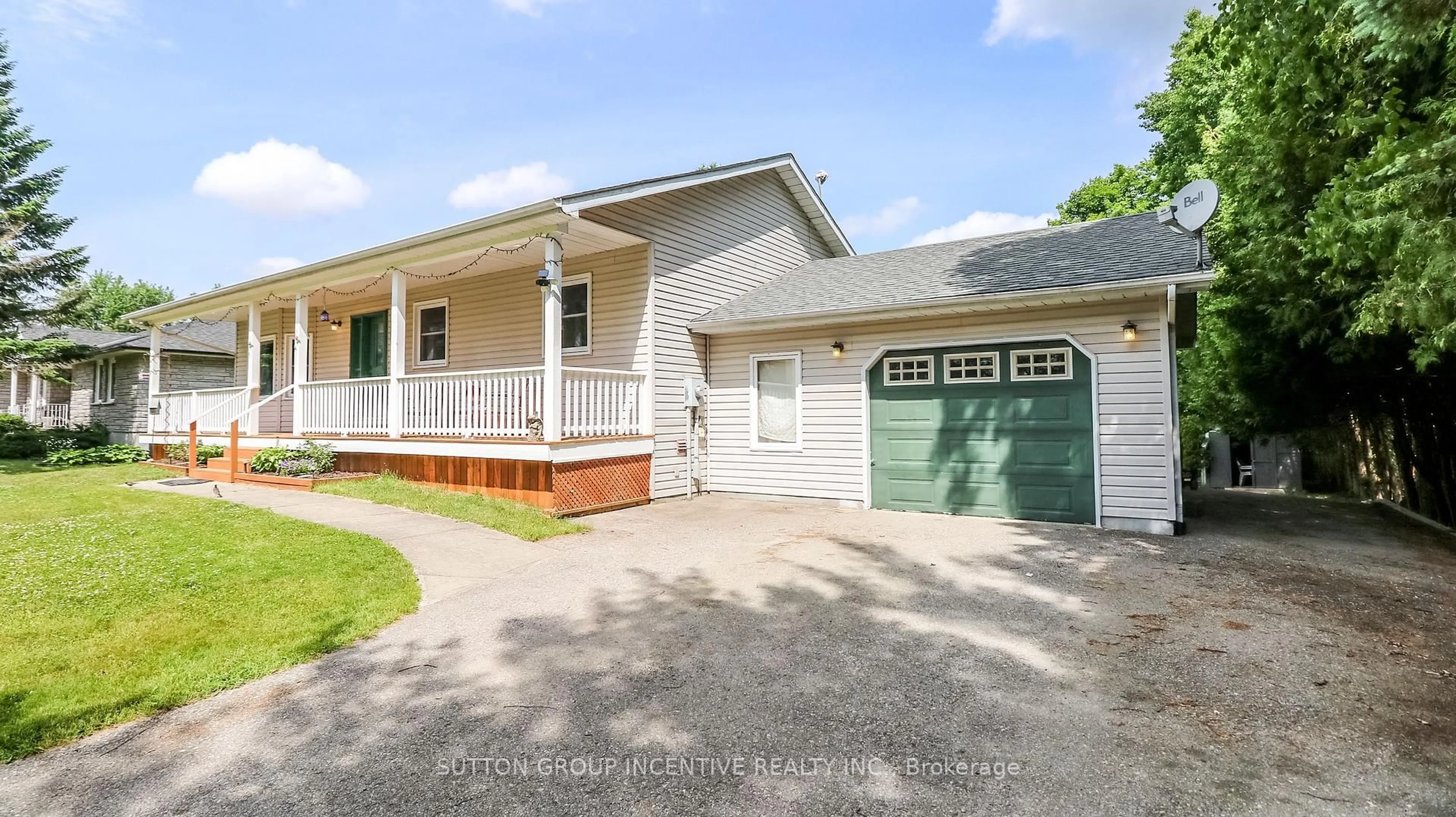 Home with vinyl exterior material, street for 54 Mill St, Springwater Ontario L0L 1V0