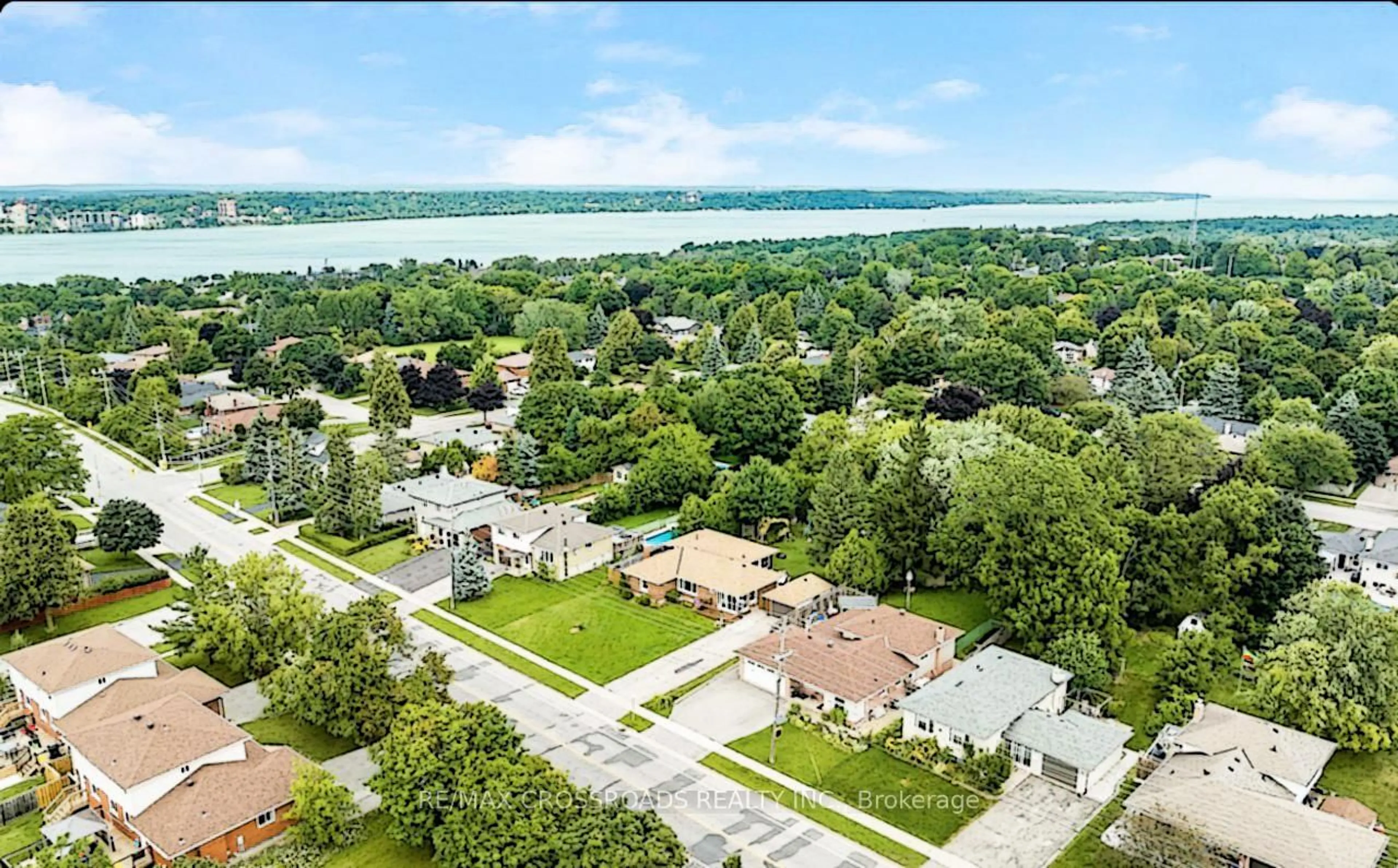 A pic from outside/outdoor area/front of a property/back of a property/a pic from drone, water/lake/river/ocean view for 105 Bayview Dr, Barrie Ontario L4N 3P3