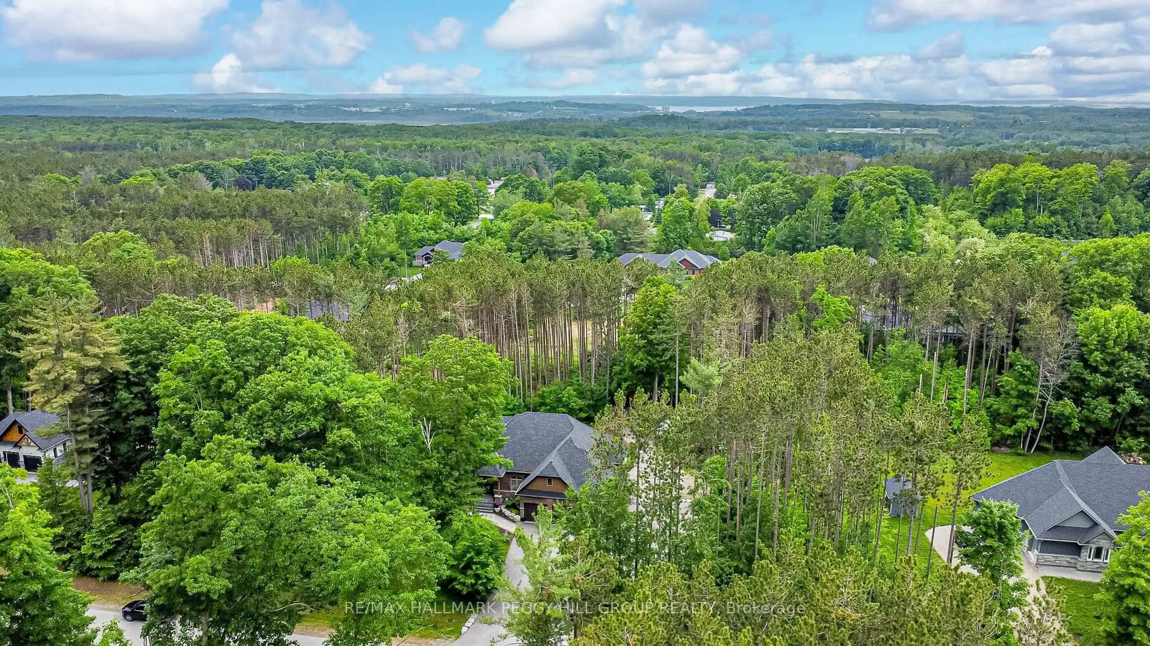 A pic from outside/outdoor area/front of a property/back of a property/a pic from drone, forest/trees view for 38 Windermere Circ, Tay Ontario L4R 0C3