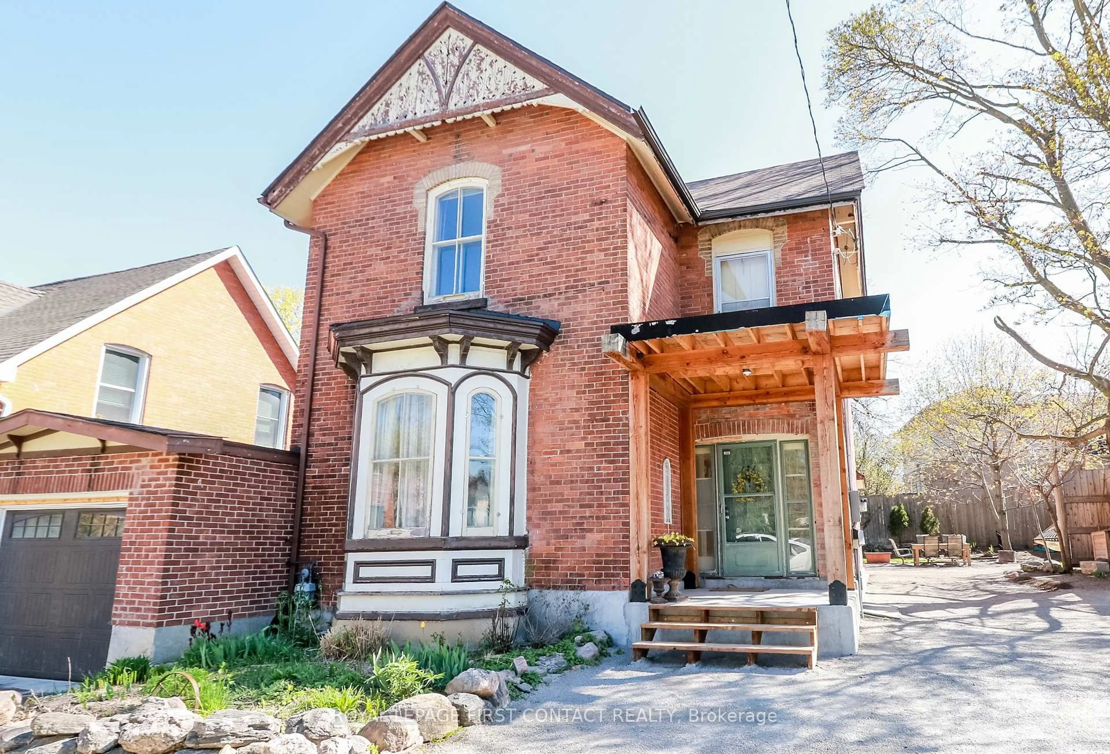 Home with brick exterior material, street for 121 Mulcaster St, Barrie Ontario L4M 3M8