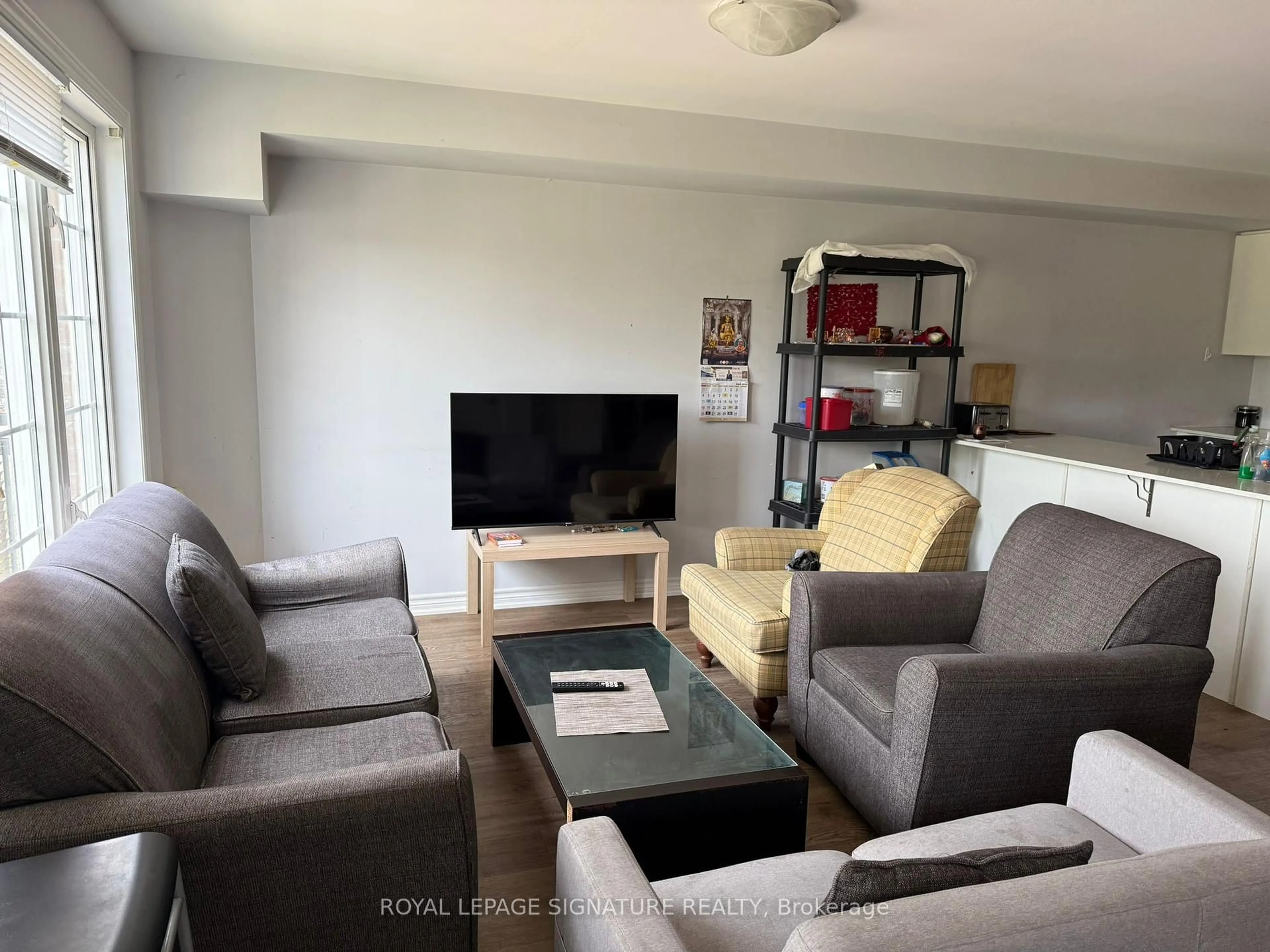 Living room with furniture, unknown for 252 Penetanguishene Rd #6, Barrie Ontario L4M 7C2