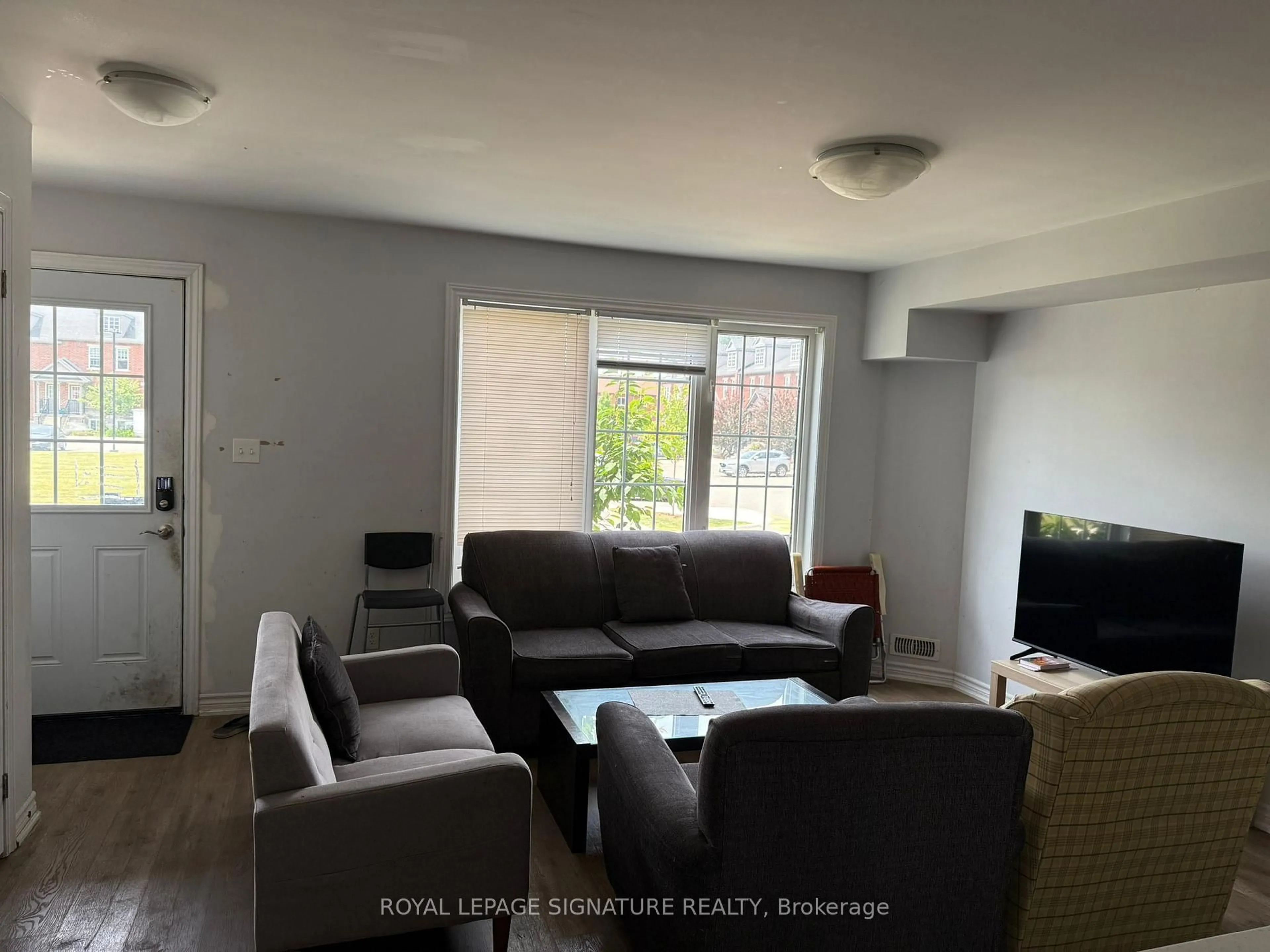 Living room with furniture, unknown for 252 Penetanguishene Rd #6, Barrie Ontario L4M 7C2