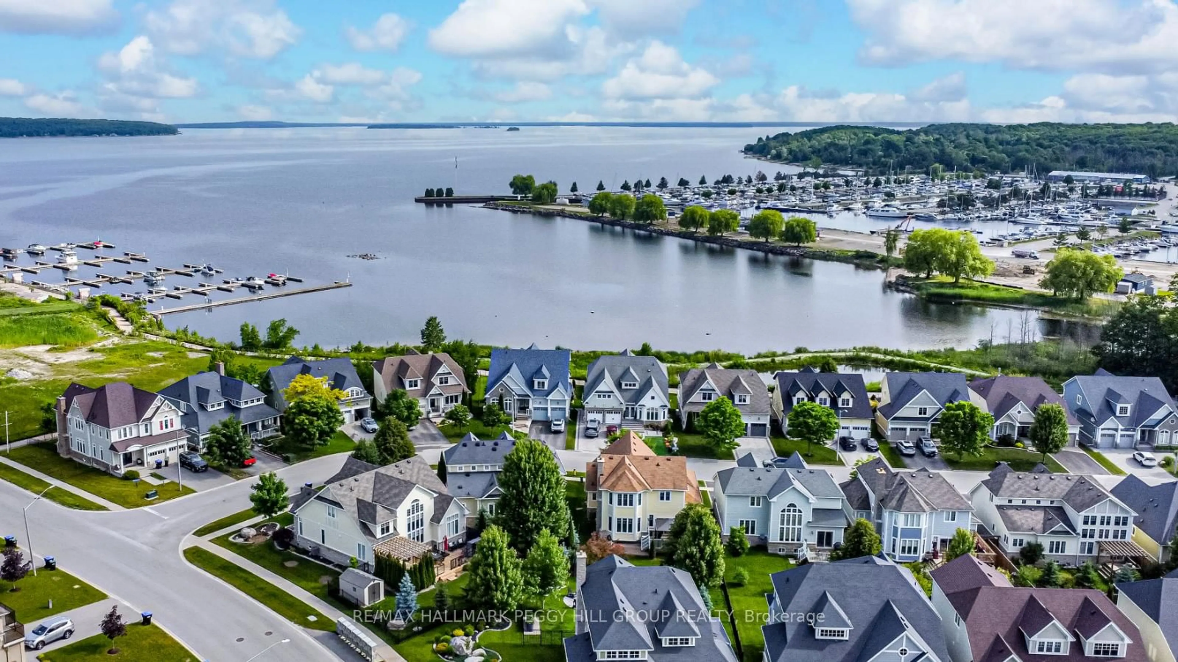 A pic from outside/outdoor area/front of a property/back of a property/a pic from drone, water/lake/river/ocean view for 9 Riverwalk Pl, Midland Ontario L4R 0B4