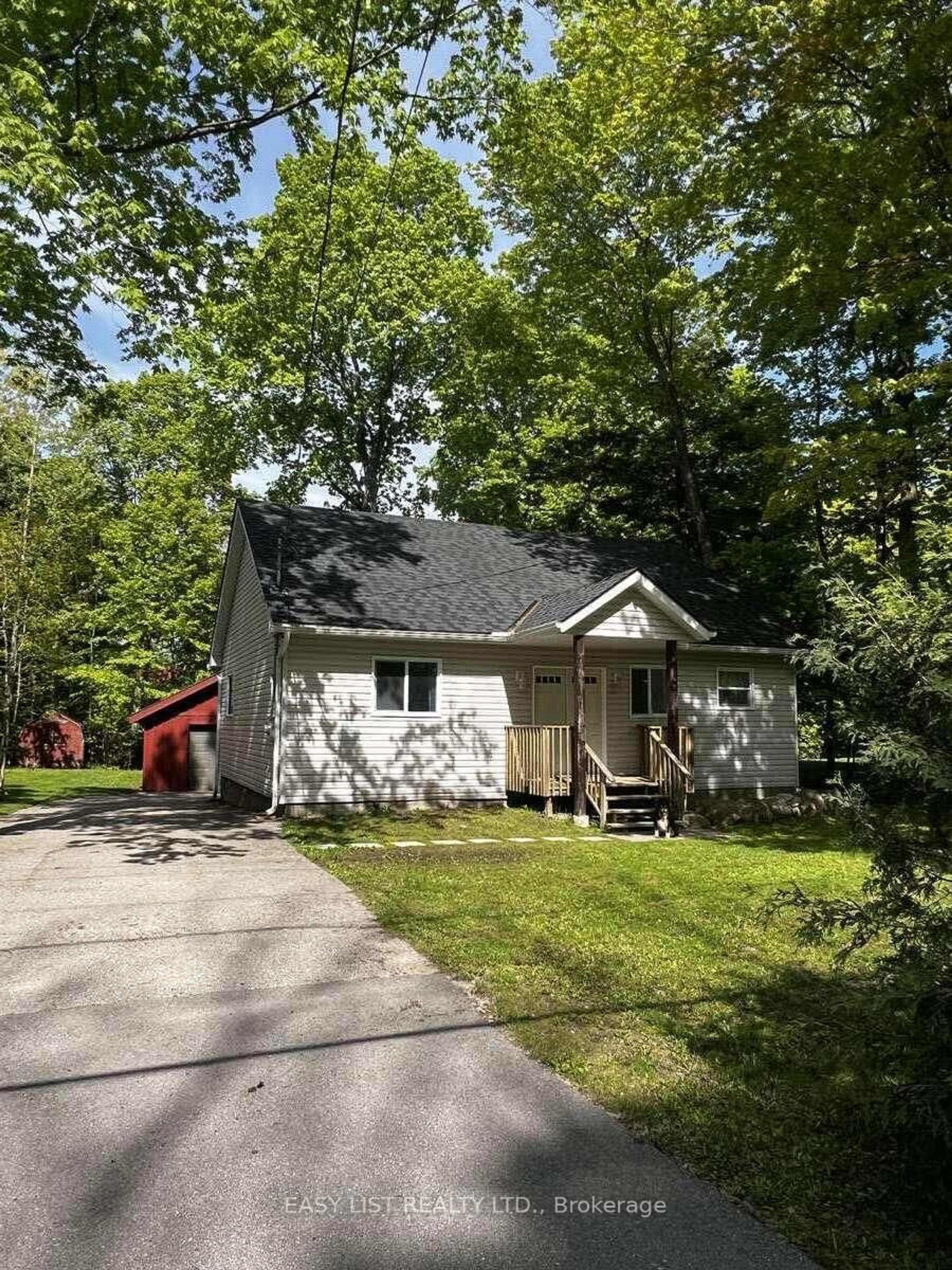 Home with vinyl exterior material, street for 2135 Champlain Rd, Tiny Ontario L9M 0B1