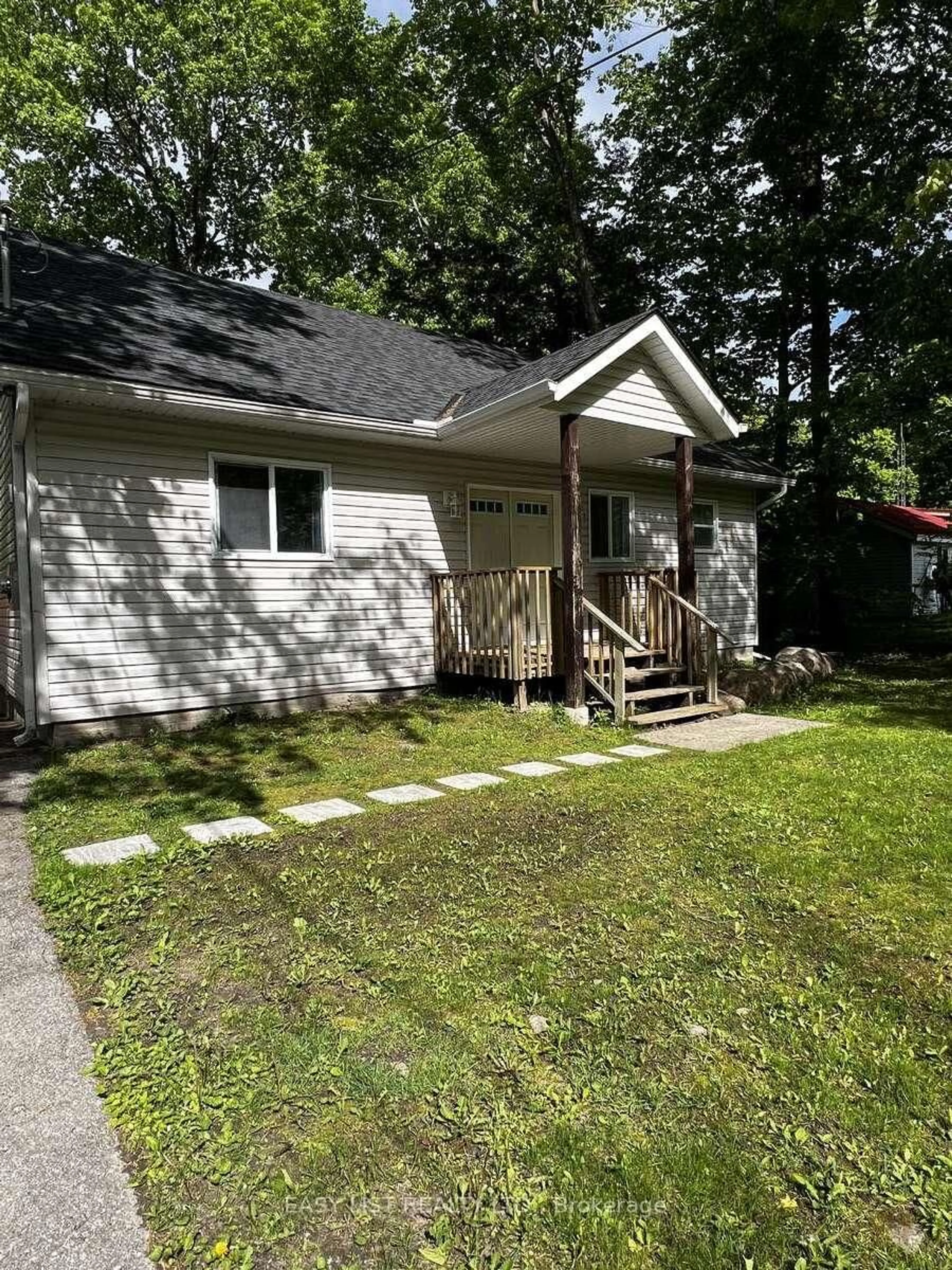 Home with vinyl exterior material, street for 2135 Champlain Rd, Tiny Ontario L9M 0B1