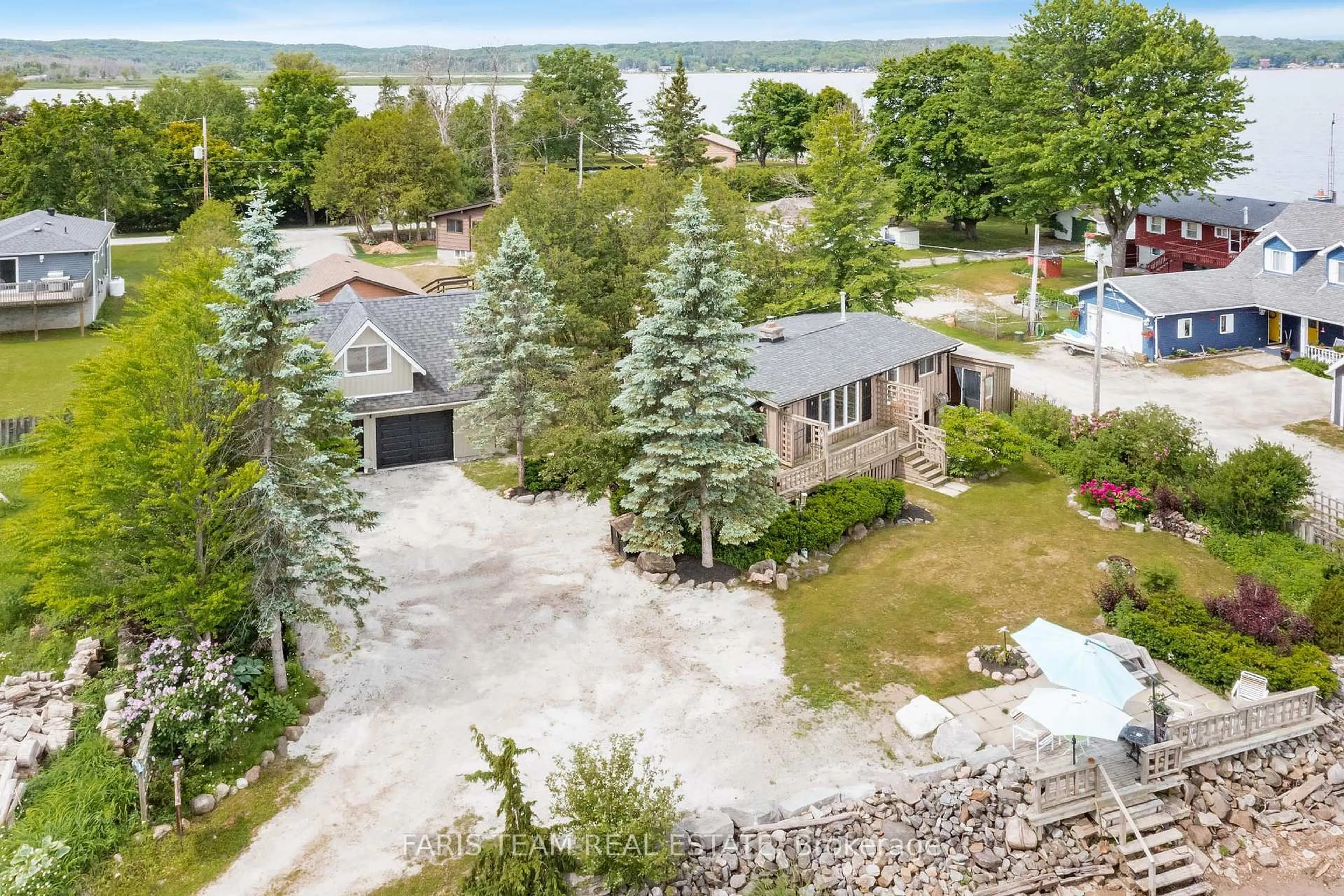 A pic from outside/outdoor area/front of a property/back of a property/a pic from drone, water/lake/river/ocean view for 4 Schooner Lane, Tay Ontario L0K 2C0