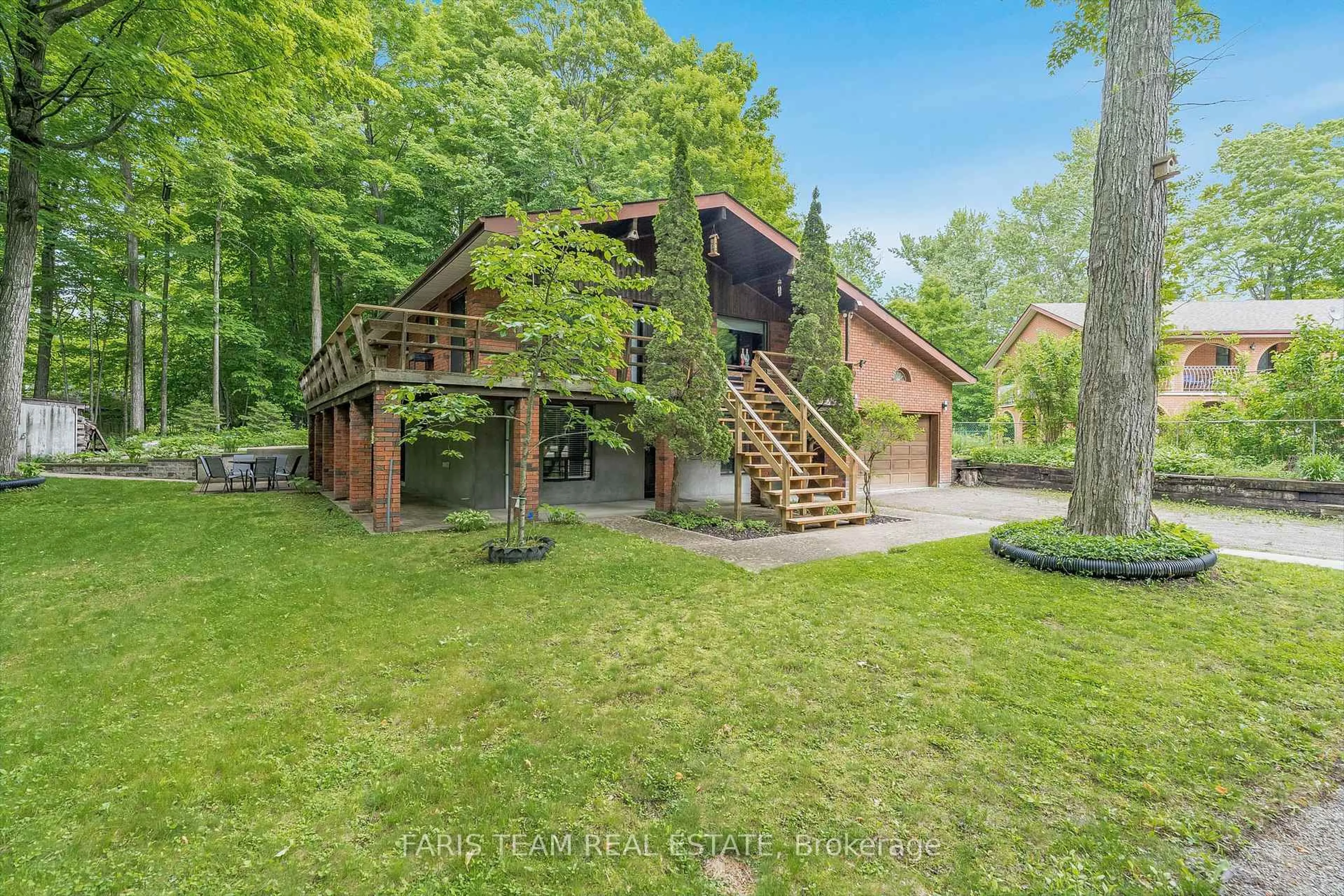 A pic from outside/outdoor area/front of a property/back of a property/a pic from drone, forest/trees view for 8 Celestine Crt, Tiny Ontario L9M 0H3