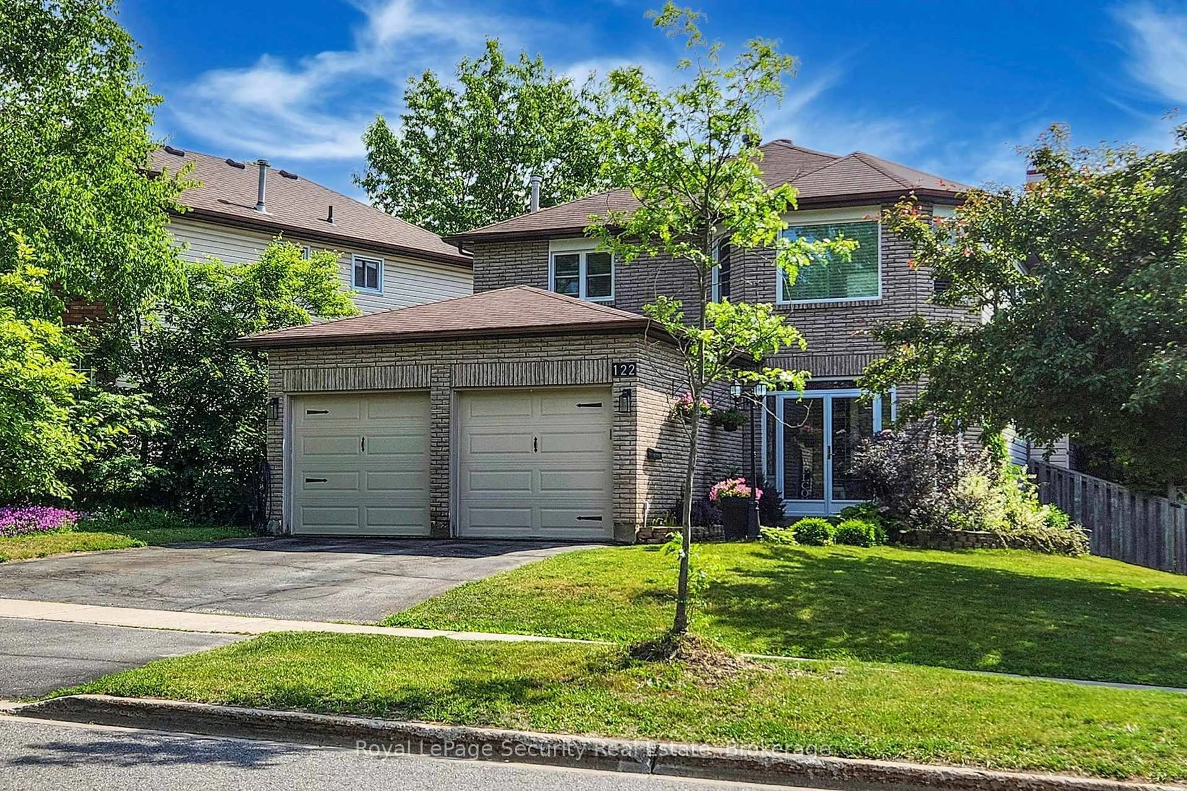 Home with brick exterior material, street for 122 Browning Tr, Barrie Ontario L4N 6R3