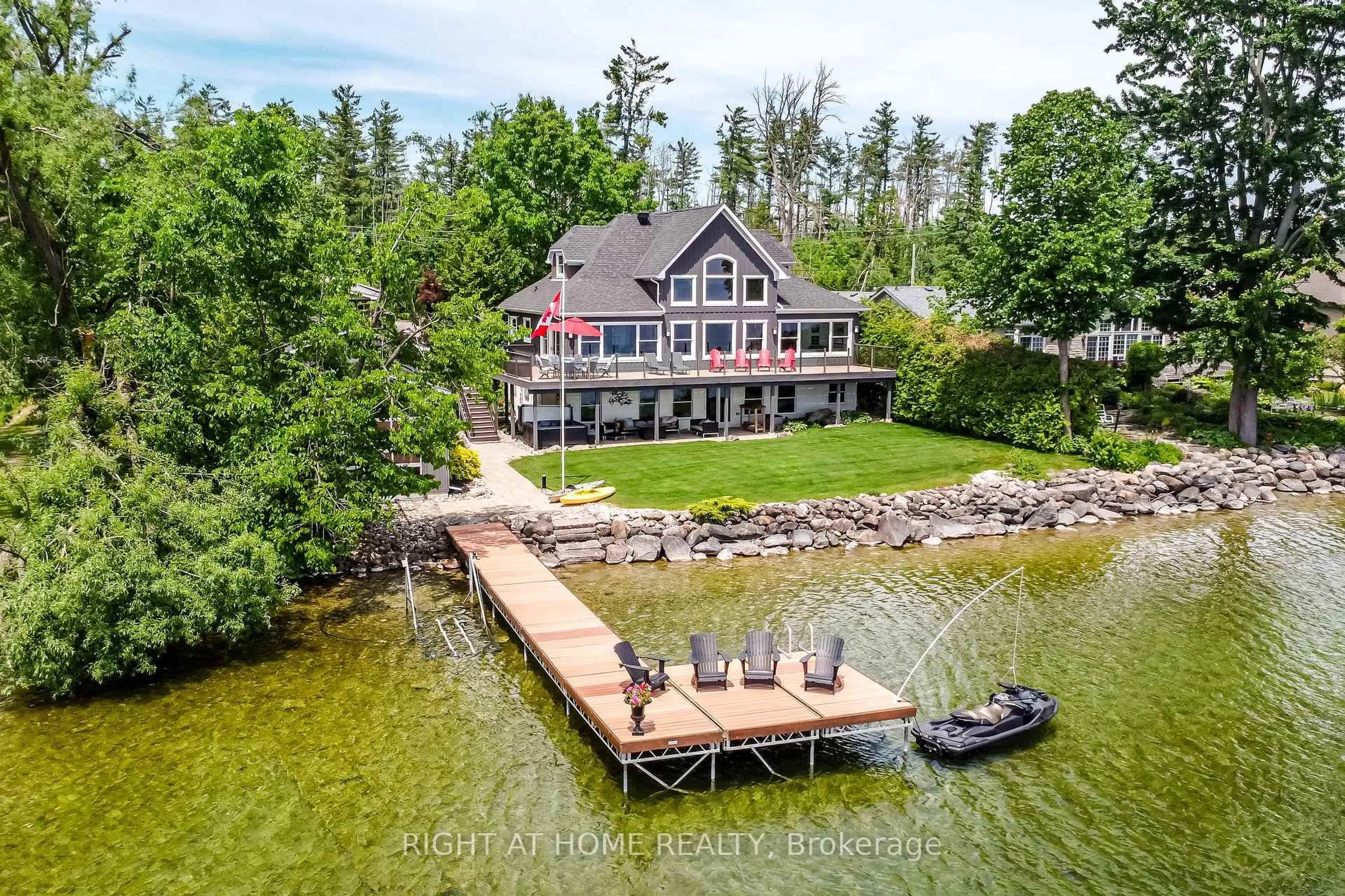 A pic from outside/outdoor area/front of a property/back of a property/a pic from drone, water/lake/river/ocean view for 21 Lakeshore Rd, Oro-Medonte Ontario L0L 2E0