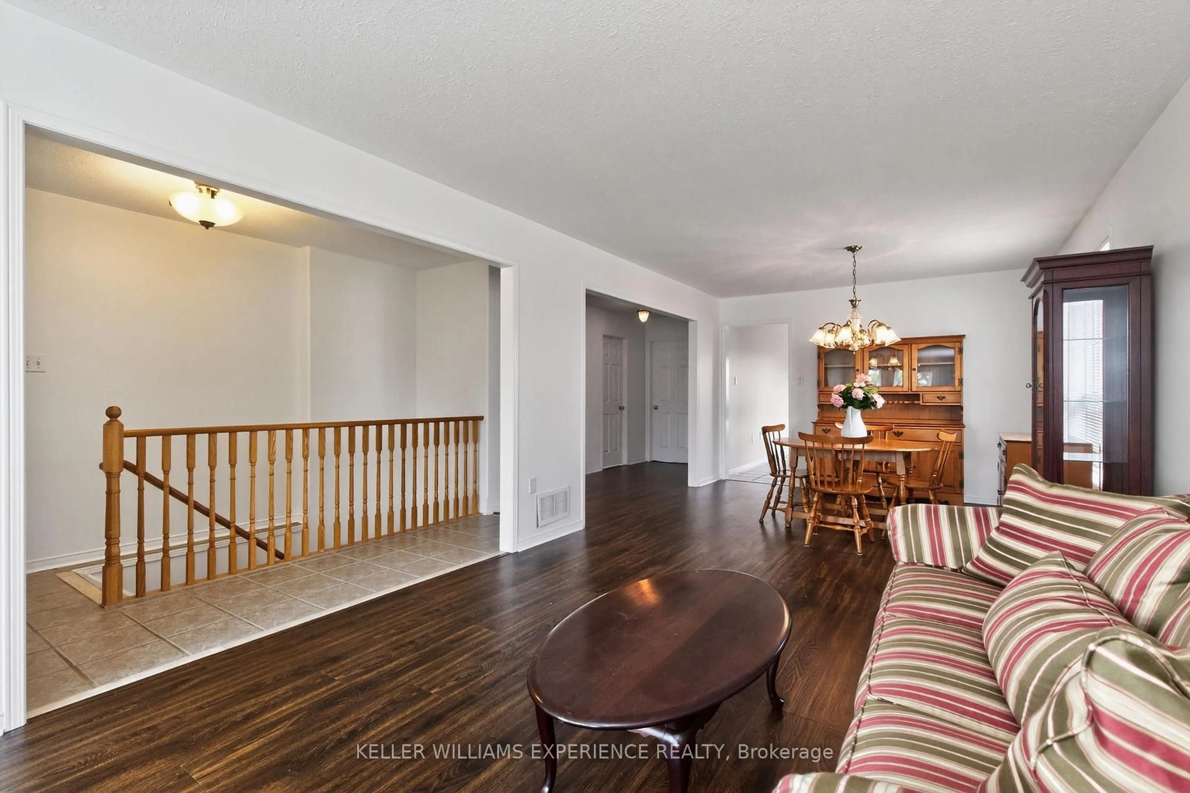 Living room with furniture, wood/laminate floor for 79 Sun King Cres, Barrie Ontario L4M 7K4