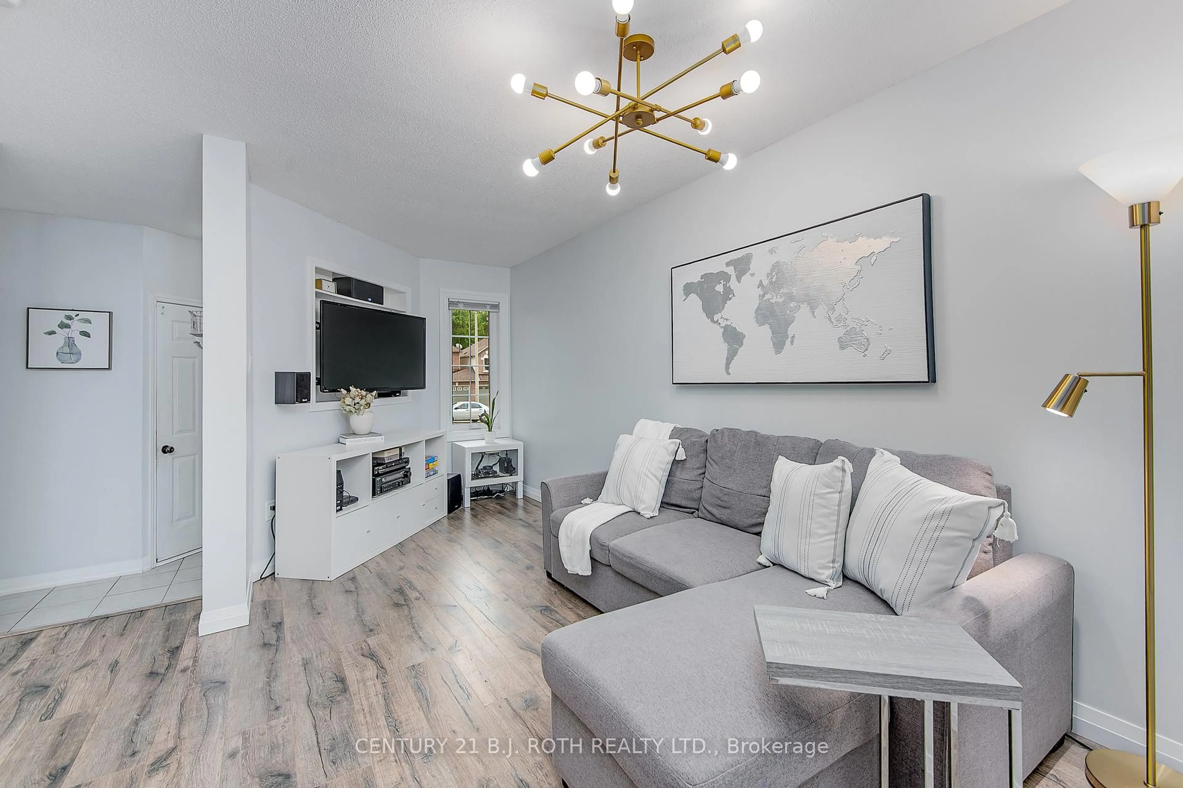 Living room with furniture, wood/laminate floor for 93 Hawthorne Cres, Barrie Ontario L4N 9Y8