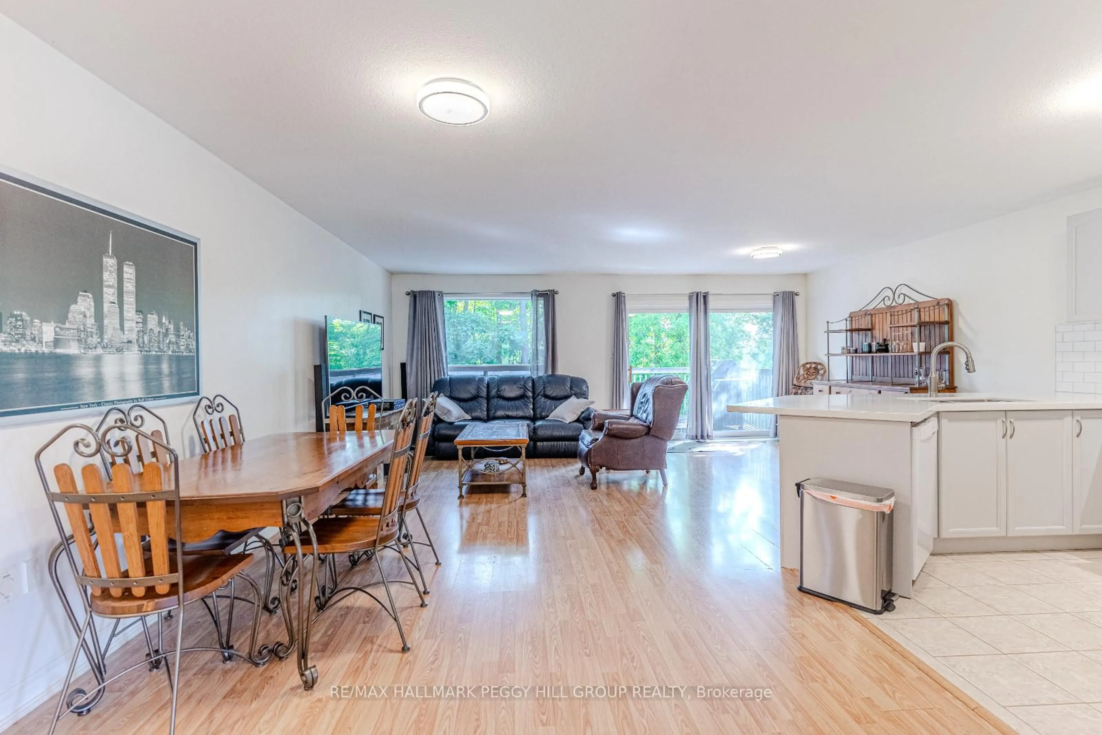 Living room with furniture, wood/laminate floor for 5 Hogan Crt, Barrie Ontario L4M 6W7